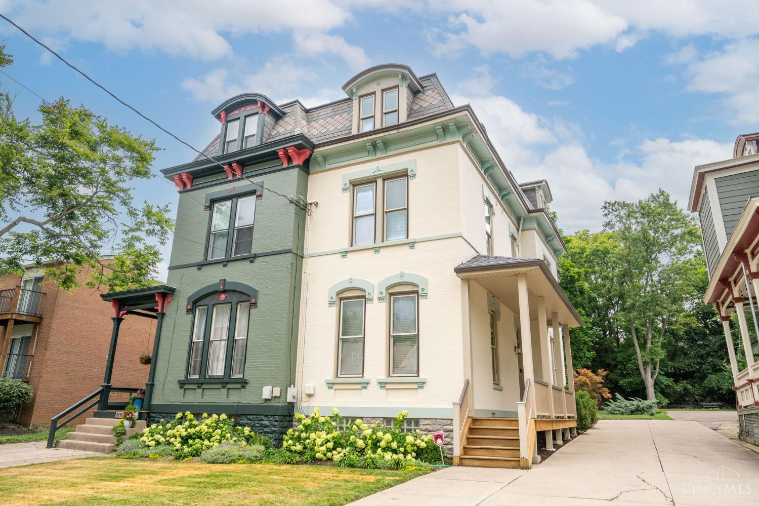 Stunning 3-story Victorian close to UC, University Hospital, and Cincinnati Children's! This fully remodeled 4BD, 3.5BA home blends historic charm with modern luxury soaring ceilings, wide staircase w/rod-iron railings, hardwood floors, built-ins & a stone gas fireplace. Gourmet kitchen features 42" cabinets, Bosch dishwasher, granite countertops and tile backsplash, island, gas stove, double oven & walk-out to a private wooded backyard. Primary suite offers jetted tub, oversized shower, walk-in closet & laundry chute. All baths updated with granite vanities & tile. Third Bedroom boasts 2 closets & window bench with storage. Third floor has its own heating and cooling system. Enjoy a spacious front porch, off-street parking, new roof, newer windows & geothermal HVAC. Cable and ethernet wired throughout, surround sound, & security system complete the package! Located near Hauck Botanic Garden w/walking trails, green roofs, & the civic garden center.