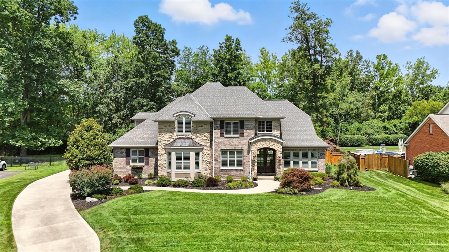 Awesome property. Everything was included in the complete rebuild....soaring foyer has access to the bright solarium, large dining room and huge coffered great room (stone fireplace, matching bookcases, and a full wall of windows). Amazing kitchen with commercial size gas cooktop, double ovens, wine cooler, island. 1st floor primary and spa like full primary bath are fantastic. The upper level has a loft, three bedrooms with a Jack/Jill and a full private bath. The finished lower level will be popular for family and friends. Prior to going to the covered/screen porch, check out the full guest bath that services pool and patio guests.  The beautifully landscaped backyard features the screened porch, covered patio, patio, heated saltwater pool, hot tub and firepit. Also noteworthy is your private access to the Hopewell Meadows Park.  Welcome HOME......