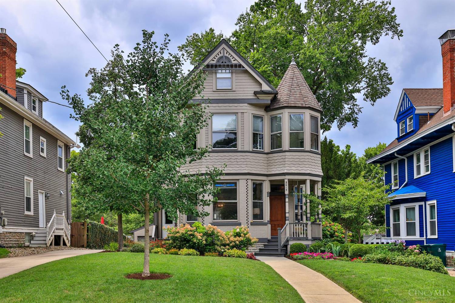 A Hyde Park Jewel! This beautifully maintained home blends timeless charm with modern updates. Original details: moldings, fireplaces, & hardwood floors combine seamlessly with today's lifestyle features. Soaring ceilings, light-filled windows, & elegant transoms enhance the open living spaces. The great room boasts a stained-glass transom & period fireplace, while the FR offers another fireplace & French doors to the covered rear porch. The stylish kitchen is equipped with top-tier appliances, a wine cooler, & custom cabinetry. Enjoy meals in the charming DR with stained-glass accents. The serene primary suite includes a spacious sitting room, walk-in closet, & luxe bath. The finished lower level offers a walkout to the patio, plus a family room & office. A 2nd-floor laundry room adds convenience. Outdoor living is exceptional with a screened porch, fenced yard, hot tub, & professional landscaping. Offers open for 48 hours. No escalation clauses.