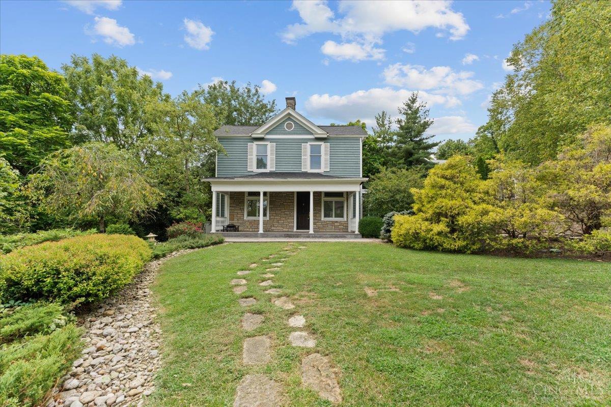 Tucked away on a private drive in historic Columbia-Tusculum, this beautifully remodeled 1885 home blends timeless charm with modern updates. Featuring 10-ft ceilings, rich hardwood floors, and stunning leaded glass windows, the 3-bed, 2-bath layout offers a formal dining room, flexible study/playroom, and spacious living areas ideal for everyday life and entertaining. The chef's kitchen boasts granite countertops, Sub-Zero fridge, gas range, ample cabinetry and a walk-out. Additional highlights include crown molding, generous room sizes and closet space, and a new rubber roof including box gutters over the kitchen (2025). Set on a landscaped 0.5-acre lot with recent exterior improvements and a 2-car garage, this property offers a rare mix of privacy, space, and character in one of Cincinnati's most iconic neighborhoods.