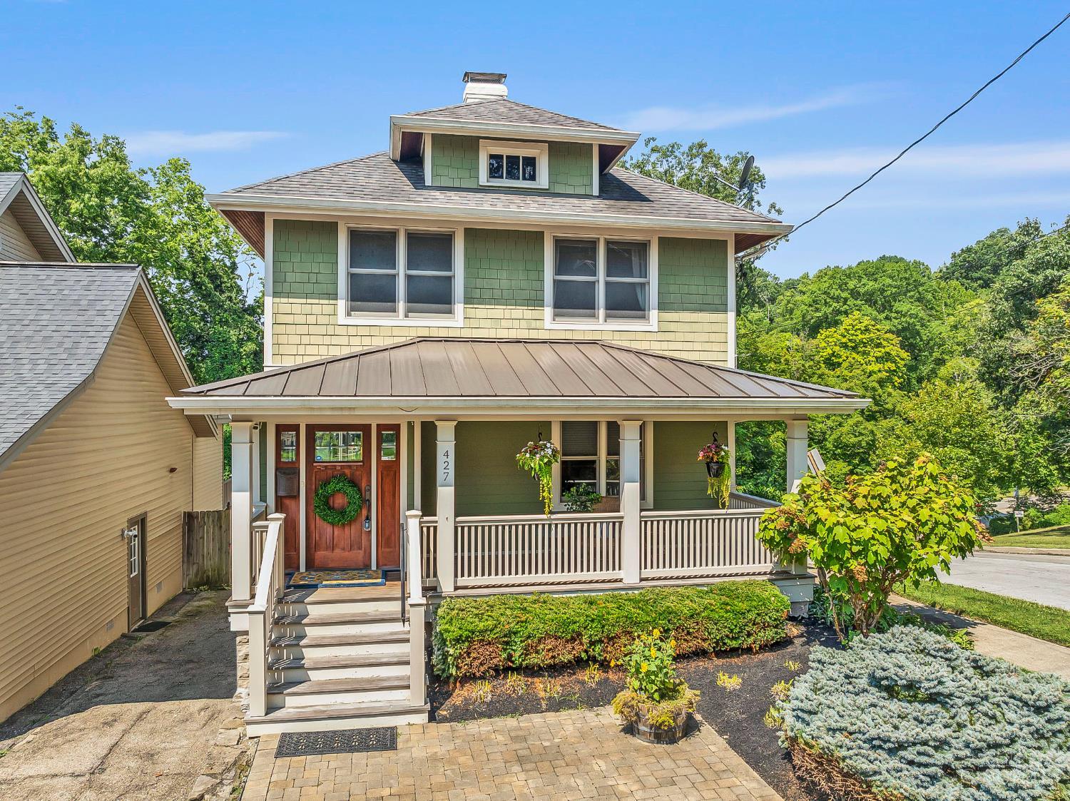 Spectacular Ohio River views and exceptional outdoor living, plus a prime location w/ easy access to all of Cincinnati! This home underwent a complete renovation in 2012, making it feel brand new, with Hardie board siding, updated plumbing, and new electrical. The layout offers great flow and is filled with abundant natural light. The gourmet kitchen boasts a Wolf range, Sub-Zero refrigerator, and granite countertops. The family room is lined with floor-to-ceiling windows and doors that open to a covered rear deck, creating the ultimate indoor/outdoor experience. The massive primary suite features two walk-in closets, a luxurious ensuite bath + a private deck (can hold a hot tub). Additional highlights include a dedicated laundry room and a finished lower level designed for entertaining, complete with a second dishwasher for easy cleanup, beverage fridge, and ice maker. The limestone back patio is perfect year-round, featuring a built-in ice box and a stunning gas fireplace.