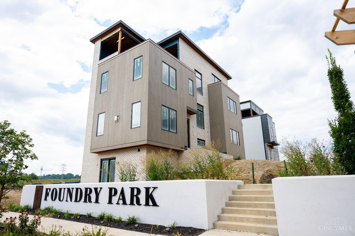 Classic Living is bringing their signature, luxury style to Foundry Park at Three Oaks: the exclusive community hosting Homearama 2025. Enjoy the ideal urban lifestyle in Oakley, just blocks from the popular restaurants, bars, and shops on Madison Road, and minutes from the dynamic offerings of Factory 52. This thoughtfully designed 4,000+ sqft, 3-bedroom, 4.5-bathroom home offers a modern open-concept layout perfect for entertaining. The main level boasts a spacious kitchen with a large island, a deck off the dining room, a walk-in pantry, and a welcoming great room with built-ins and a fireplace. On the second floor, you'll find two elegant bedroom suites, a convenient laundry room, and a versatile office/loft space. The rooftop level features a media room, a full bath and access to a luxurious outdoor living space. 10ft ceilings in LL, 1st and 2nd floors plus two HVAC systems for maximum comfort. Move in Oct 2025. This exceptional home is an opportunity not to be missed!