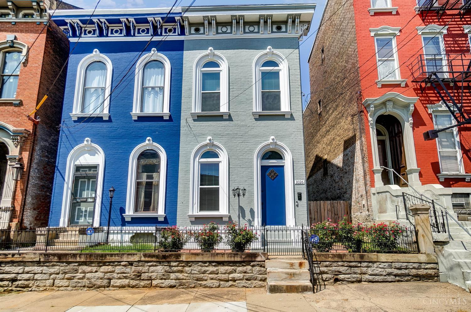 This Italianate beauty underwent a stunning renovation! Live on historic Dayton Street in rapidly revitalizing West End! Breathtaking original crown molding, trim, doors and staircase. High end finishes include quartz countertops, hardwood floors, marble tile, waterfall shower heads, soaking tub and a 1 car garage! Perfect for entertaining with 12 foot ceilings, built in bar, inviting patio and landscaped yard! Brand new electric, plumbing, roof and mechanicals. Surrounded by homes under renovation and next door to Heberle Lofts opening in late 2027! All walking distance to OTR, TQL Stadium and the $300 Million West End Entertainment District opening in 2026!