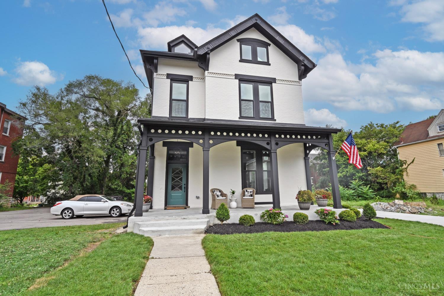Top-notch fully renovated home in hot Evanston w/ 15-yr tax abatement eligible! Soaring 12-ft ceilings & open floorplan create a bright, modern feel. Dream gourmet kitchen with high-end gas range, fresh cabinetry & quartz. Spacious primary suite features gorgeous ensuite bath + large walk-in. 2 additional bedrooms share stylish Jack & Jill bath; 2nd-fl laundry adds convenience. 3rd floor retreat offers huge ensuite BR or flexible media/rec rm w/ full bath. Beautiful landscaping, charming front porch, & oversized deck ideal for entertaining. Every detail thoughtfully updated  while maintaining some of the original charm - move right in & enjoy Evanston, one of Cincy's fastest growing neighborhoods!