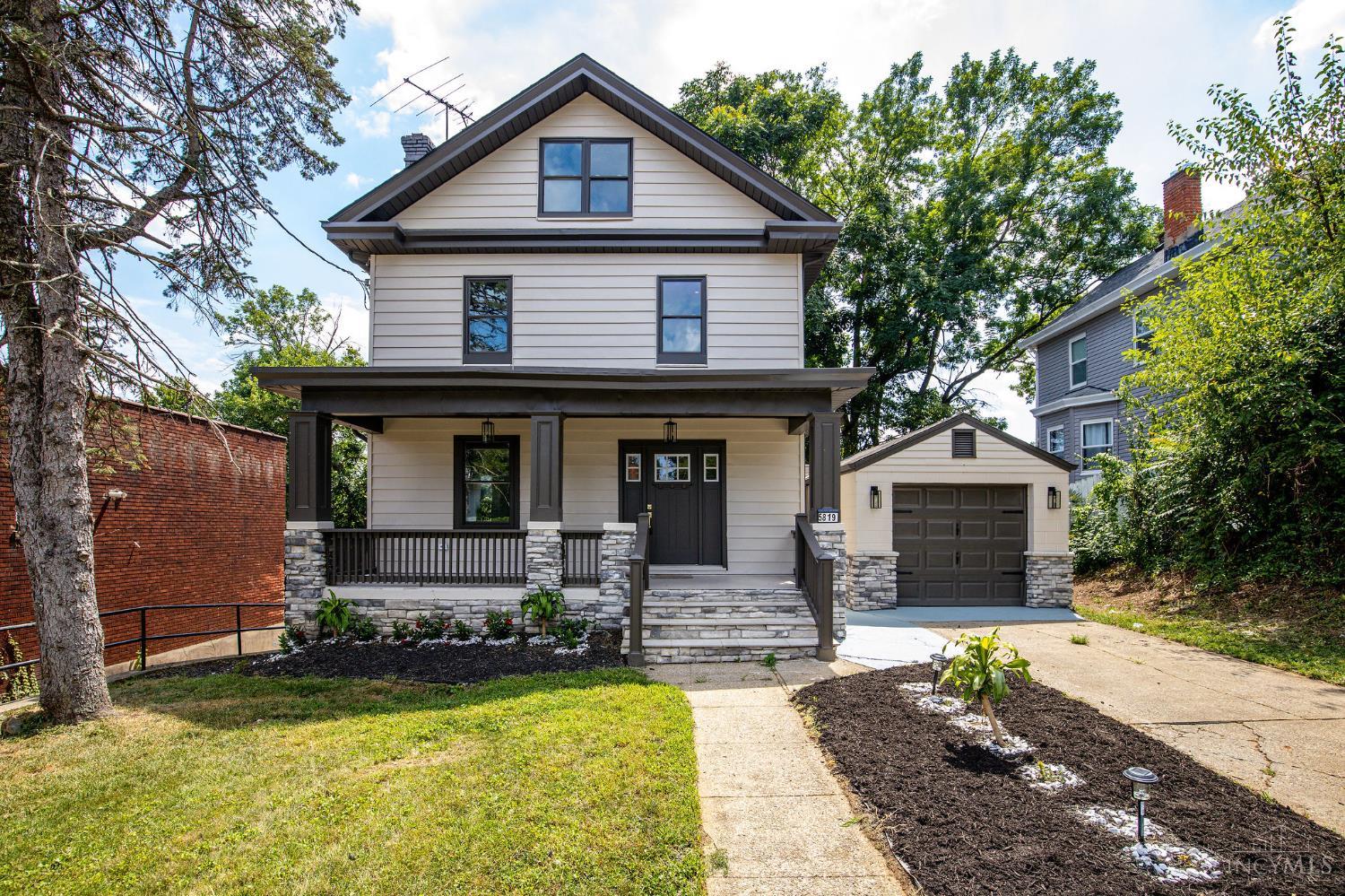 This Magazine-Worthy Home just underwent an Extensive Top-to-Bottom Renovation in 2025! It's Perfectly Situated in the Heart of Madisonville, with 5 Bedrooms, 3.5 Baths, & 2,300+ Finished SqFt, & walkable to Popular Shops, Eateries, & Parks. Everything was Meticulously Crafted - from the Thoughtful Layout to the Custom Finishes & Designer Bathrooms. Entering from the Covered Front Porch, you'll be Instantly Drawn to the Open Layout & Tall Ceilings. The Kitchen Shines with White Cabinetry/Backsplash, Timeless Quartz Countertops, an Eat-In Peninsula, & Brushed Gold Fixtures. The 2nd Floor Primary En-Suite Presents a Large Adjoining Bathroom, Dual Closets, PLUS a Private Walk-Out Balcony. Two Additional Bedrooms are Located on both 2nd & 3rd Floors. Exiting the Back Door, you'll Love Overlooking the Expansive Yard & Fire Pit from your New Deck. Spread Out even more in the Finished Lower Level, with its own Walk-Out to the Lower Patio. Detached 1-Car Garage. Virtual 3D Tour Attached!