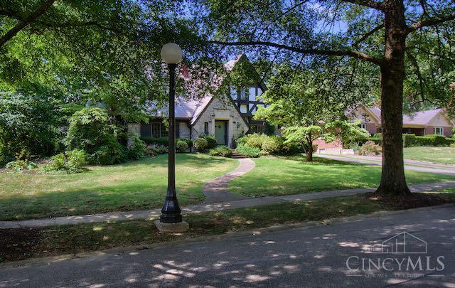 Welcome to 3833 Eileen, a highly detailed tudor on a premier street in the heart of Oakley. This 4 bedroom home's longtime owners have been stewards of the house over the last four decades- threading the needle between honoring the house and creating space for their day-to-day lives. The first floor has been maintained in a period correct design. The kitchen which was renovated about 20 years ago is a timeless example of workflow, livability and scale. A side entry door from the kitchen gives easy access for grocery deliveries. The first floor has 3 rooms which were originally bedrooms and on the second floor are two additional bedrooms and a full bathroom. The second floor could be used as a primary bedroom suite or you could use the first floors rear room. The semi-finished lower level offers a full bathroom, laundry and casual living space. The 2 car garage, storage and mechanicals exist within this space as well.