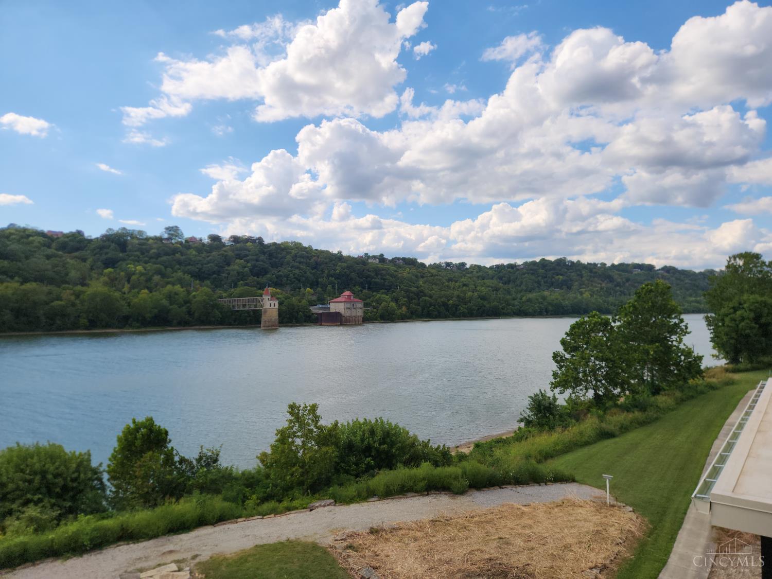 REMARKABLE RIVER FRONT HOME! 2 Stunning Primary Suites w/Beautifully Customized Porcelain walk in showers! 3 secondary bedrooms,comfortable study/lounging rm walk out to a covered deck with a fabulous Water View! Joe Zang's infamous attention to detail brings this finish level to unmatched heights! Selections made are Rich and Tasteful offering a clean yet warm elegance to this home. The Views are nothing short of spectacular w/o any effort from all three levels! Easy Access to all three levels by elevator or stairs! This Home is Truly a Gem in a Riverview Community w/ commercial boat ramp,seasonal dock, walking trail and community fire pit along the River bank, neighborhood Park w/play yard and ball fields, Easy access to Cincinnati's renown bike trails. Completion by 12/31/25. There is still time to make personal selections regarding the second/prep kitchen/content and finishes and closet personalizations . This home is a  Showstopper!Unlimited Platinum 15 yr abatement.