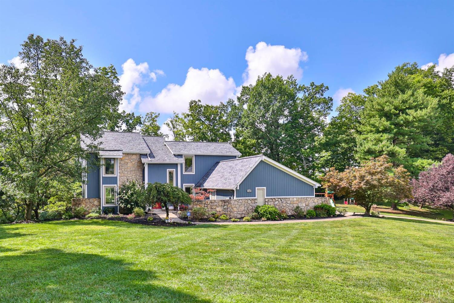 Tucked away at the end of a peaceful cul-de-sac in the highly sought-after Palisades subdivision, this stunning contemporary retreat offers the perfect blend of privacy, comfort, & convenience- just 15 minutes from downtown & moments from the Anderson Ferry. Nearly 1.4 acres of beautifully landscaped grounds w/seasonal views of the Ohio River, giving you a picturesque backdrop all year round. Inside, enjoy brand-new carpet that pairs perfectly w/elegant hardwood floors & new stainless appliances that remain. The spacious 1st primary suite offers a relaxing escape, while the finished walk-out lower level includes a cozy stone fireplace- ideal for entertaining or quiet nights in. Step outside to an expansive composite deck surrounded by mature trees in a parklike setting. More storage & closet space than you'll know what to do with & a Cinch home warranty included, this home checks every box. Don't miss your chance to own this one-of-a-kind property- schedule your tour today!