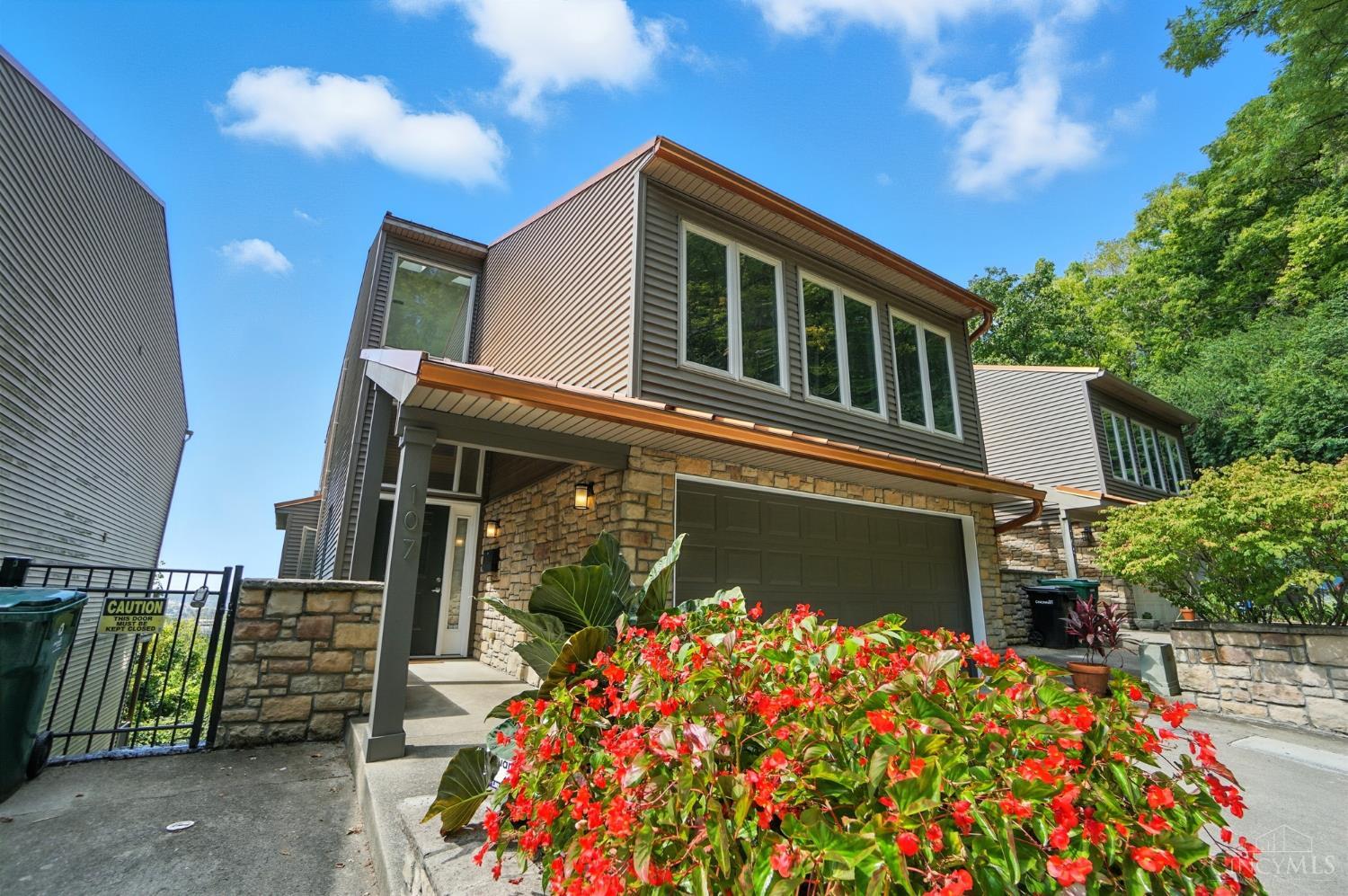 Stunning 3-level contemporary home at the end of a no-outlet street. 3,300+ SF of light-filled living space. 10 ft Ceilings! Jaw-dropping panoramic city views. Dramatic 2-story entry leads to an airy, open floor plan w/ glass rear wall that brings the outdoors in. Gourmet kitchen features 42" maple cabs, granite counters, & pro-grade SS appl, flowing into spacious living/dining areas perfect for entertaining or unwinding. Luxe 2nd-flr primary suite incl a cozy FP, skyline views, spa bath w/jetted tub, tile shower, & skylit walk-in closet. Flexible 4th BR/Study/Gym adds versatility for today's lifestyle.  Surround sound, 2nd FL laundry, Zoned HVAC, & privacy glass block. Three decks offer perfect spots for morning coffee or watching fall foliage, fireworks & weather roll in across the Ohio River. Secure 2-car Gar. Off-street pkg. Located mins from dwntwn Cincy, NKY, major hwys, Findlay Market, hospitals, theaters, & top restaurants. Combines city convenience w/ rare privacy & seclusion.