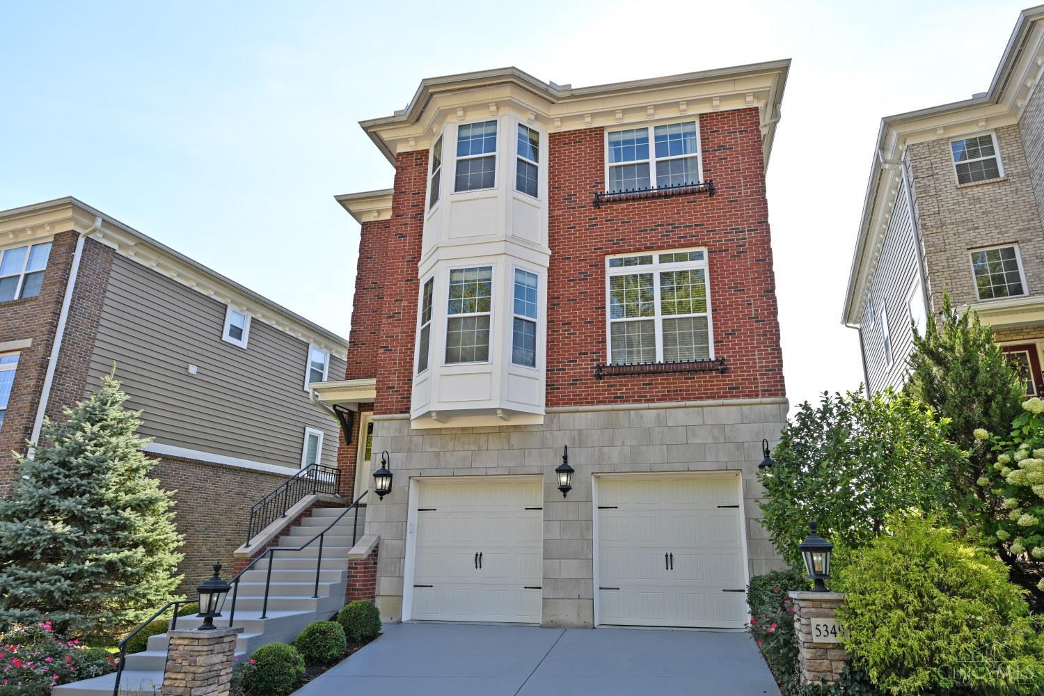 Welcome to the Views of Kenwood! Impeccable kitchen with a great living room for entertaining or relaxing. Every window has amazing views overlooking the valley and city. You can watch the storms roll in, planes landing at Lunken, and enjoy sunsets every night on your balconies. The vertical living allows four different spaces to be used to fit your lifestyle.  4 beds, 4 full baths and 1 half bath over several floors of grand living.  New paint, new lower level, new flooring on the second floor, new carpet.  Lots of tax abatement left which saves thousands on property taxes!!   Over 4150 square feet of house with tremendous views. Welcome to your new home!