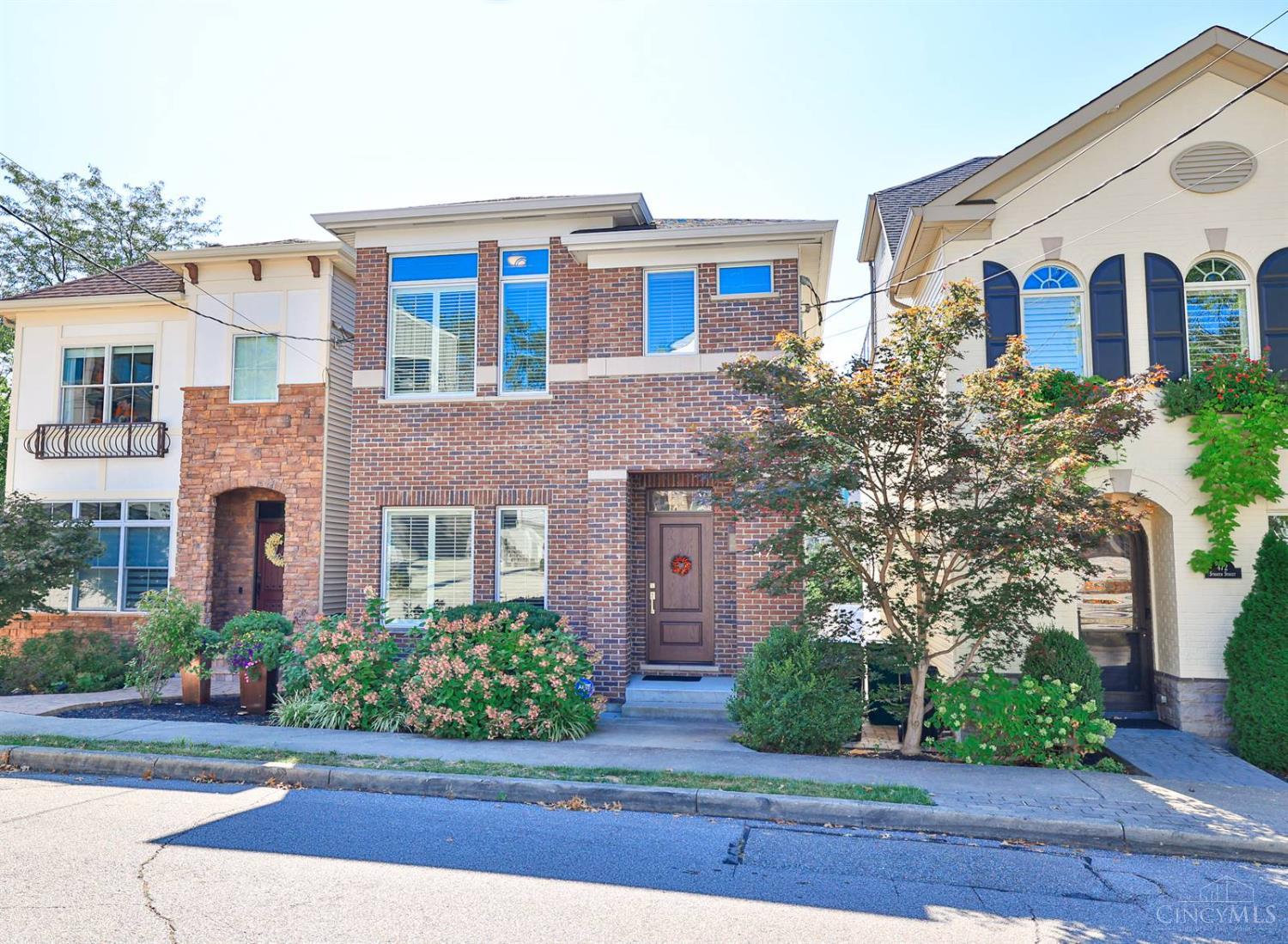 Move-in ready home nestled in a highly desirable neighborhood, where modern elegance meets style and functionality. Tax abated through 2028 (payable in 2030), this 3-bedroom, 3.5 bath features wood floors flow throughout the light-filled great room, gourmet kitchen, 9ft ceilings & wonderful views from the decks. The primary suite boasts vaulted ceiling, double vanity, walk-in closet, and spa-like atmosphere. The second floor includes a convenient laundry room, spacious bedrooms and additional full bath. The finished lower level offers versatile flex space perfect for a family room, home gym, office, or additional bedroom, complete with a full bath. Hard to find 3-car garage. Enjoy the social neighborhood including block parties, book clubs and family friendly events. Located within walking distance to a variety of restaurants, bars, fitness studios, and so much more!