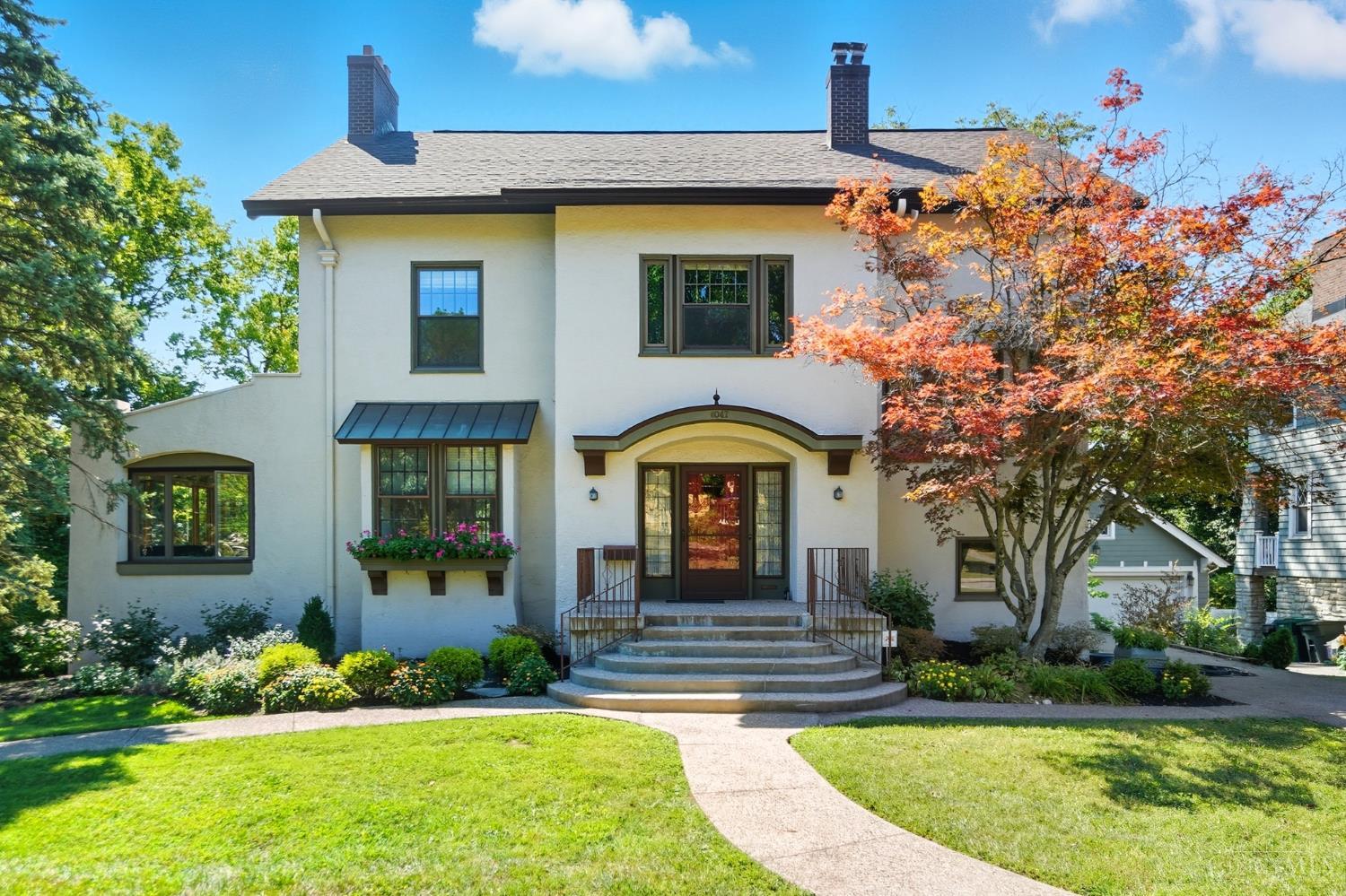 Charming Prairie style Mediterranean Revival in North Avondale home. Situated on the coveted Rose Hill gaslight loop. This home features 4-5BR, 2.2BA showcasing timeless charm and modern updates. Spacious foyer w/dual closets, sunroom or family room, dining room walkout to updated deck.Updated butler's pantry & stylish half bath. Kitchen (2019), features custom soft close cabinets, pull outs, under cabinet lighting & updated appliances. Primary ensuite with dual closets, study & hardwood under carpet. 3rd floor updated & new windows, 2 bedrooms & Bath option & heat. LL offers laundry chute, half bath, walkout & glass block windows. New HVAC (3 yrs), roof (