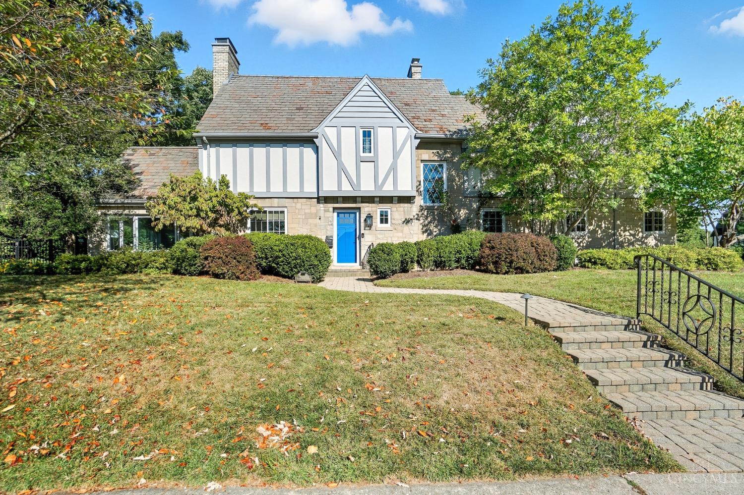 One of Cincinnati's finest homes! This Mt. Lookout beauty is set to impress with nearly 3,400 square feet of living space. The 1st floor features an updated kitchen, adjacent dining room, huge living room/breakfast room with fireplace & built-ins + sunny family room with a soaring ceiling. Upstairs you will find 3 generously sized bedrooms and 2 full baths. The primary suite has a cathedral beamed ceiling, attached bath & walk-in closet! The finished basement has a fireplace, half bath and plenty of storage. Nice covered patio leads to a beautiful, fenced yard! 2 car garage! This home is the perfect blend of modern updates and old world charm!