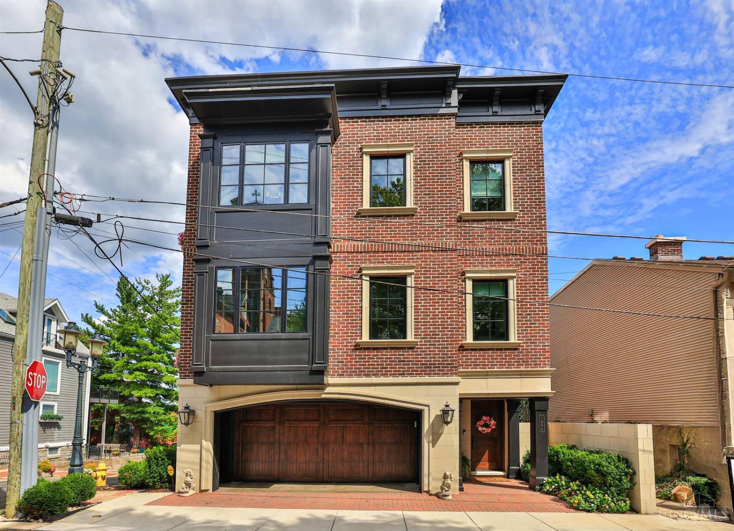 Magnificent Mt. Adams Living! Custom, luxury home with city & Ohio River views just minutes from downtown. Hardwood floors throughout with sleek Pella black windows. Chef's kitchen with Wolf range/oven, warming drawer, custom cabinetry & large island, plus butler's pantry with sink, dishwasher, microwave & storage. Living area with gas fireplace opens to covered terrace with retractable doors, heaters & outdoor TV. Elegant dining room with tray ceiling & lit storage; pub/bar with wine refrigerator & Ice maker. Four-stop elevator to all levels, including LL suite with private entrance, bath & kitchenette. Solar panels, 24K Generac generator, Platinum LEED certification (c.14 yrs tax abatement), EV-ready in the 2-car garage. Rooftop terrace with solar windows & window boxes with built-in watering system. Offers open for 48 hours. No escalation clauses.Pre-qualification letter needed before any appt will be confirmed.