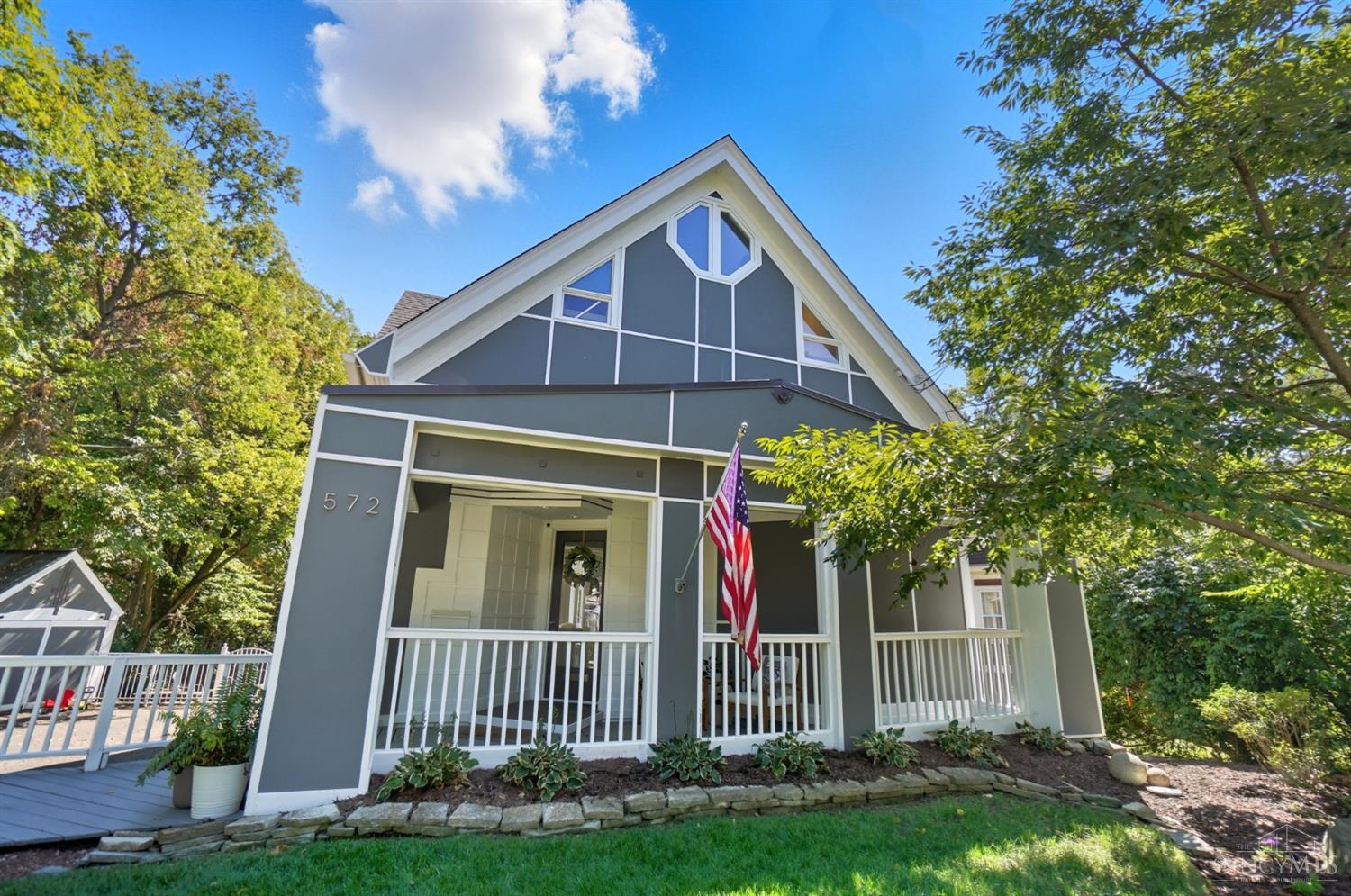Discover adorable one-of-a-kind coastal chic style, just minutes from Mt. Lookout Sq. This bright, open home features a lovely dining area flowing into a spacious living room with a marble fireplace & wall of windows. The beautifully updated kitchen offers generous storage, a large island, stainless appliances, wine fridge, & breakfast nook that opens to the spacious fenced rear yard. A flexible 1st fl bdrm has a gorgeous full bath & huge closet. The nifty doggie room under the stairs add extra charm. Upstairs features 3 additional bdrms, 2 full baths, a versatile loft, & balcony. Enjoy entertaining outdoors with a spacious deck, new 500-sq.-ft. patio, & private tree-lined views. Recent updates include a new A/C, water softener, & dryer.