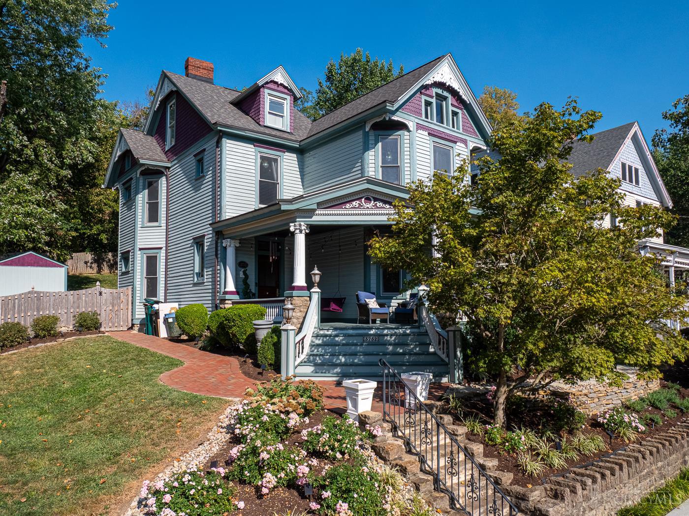 Stunning 1887 Painted Lady in coveted Columbia Tusculumwhere historic character meets modern luxury! With jaw-dropping curb appeal and a rare oversized lot for the area, this 4 BD, 2.5 BA Victorian gem boasts a bright and airy main living space that begs to entertain. Enjoy the wraparound front porch, expansive paver patios (2022), and beautifully landscaped yards. The open kitchen with exposed brick & tray ceiling flows seamlessly into living areas, while a large formal study adds versatility. The primary suite is a true retreat with custom walk in closet and spa-like bath featuring walk-in shower, soaking tub, heated floors & ornate tile. Historic charm shines through original stained glass & 3 decorative fireplaces. All baths updated; mini-split added to 4th-floor bedroom. Major updates include HVAC (2019) & water heater (2023). Walk to shops, parks & restaurants in Columbia Tusculum's vibrant community.