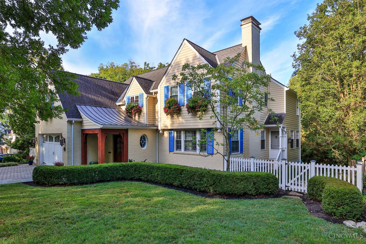 An exceptional home on a quintessential street, blending timeless details with modern updates. The chef's kitchen boasts a professional Viking oven, high-end appliances, & custom cabinetry. The dining room is a true showpiece with its tray ceiling & lighted architectural dome. French doors open to the upper terrace, while the study offers built-in shelves & a window seat. A Dutch door walkout leads to the side yard. The primary suite includes a luxurious bath, & the lower-level rec room features custom cabinets & designer lighting. Outdoors, enjoy a charming bluestone paver walkway, custom window boxes with irrigation, & an enclosed rear porch with fireplace overlooking the wooded yard. All offers open 24 hours. No escalation clauses.