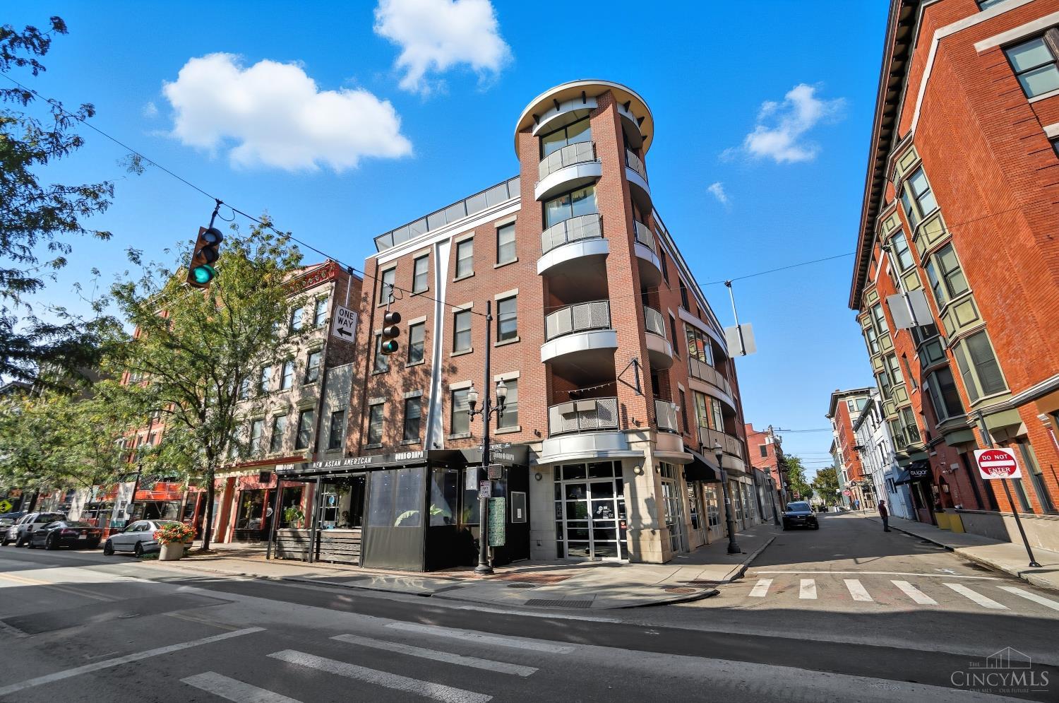 Wanting an Urban Chic lifestyle? Come check out this newer-construction building in the heart of historic OTR, steps away from all the amazing & on-trend OTR restaurants & pubs, bakeries & coffee shops, and an easy walk to OTR Kroger, Washington Park, TQL Stadium & Music Hall. Inside this ultra desirable Trinity Flats condo you'll enjoy 9' ceilings, bamboo flooring, a gourmet kitchen, 2 oversized full baths, a home-office/flex space w/built-in desk, an extremely private balcony on the back side of the building with access from the owners' suite & great room, an in-building elevator, and a secure 1-car assigned garage parking space. Unit comes with additional storage closet, utility closet, & an in-unit laundry w/included washer & dryer. Enjoy everything downtown living has to offer in this modern OTR building!