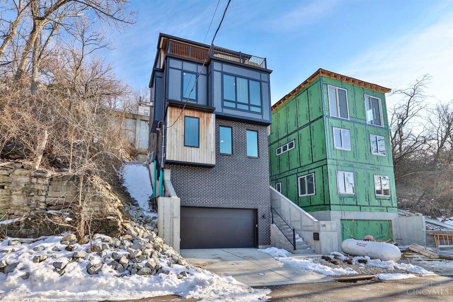 Spectacular Leed Platinum Home! Over $300,000 in Tax Abatement Incentives! Completed in 2024. High end appliances, gleaming HW floors. Spectacular top floor outdoor deck with fold away glass wall over looking the City. Oversized garage (room for a lift). Also, for lease for $4500 per month.