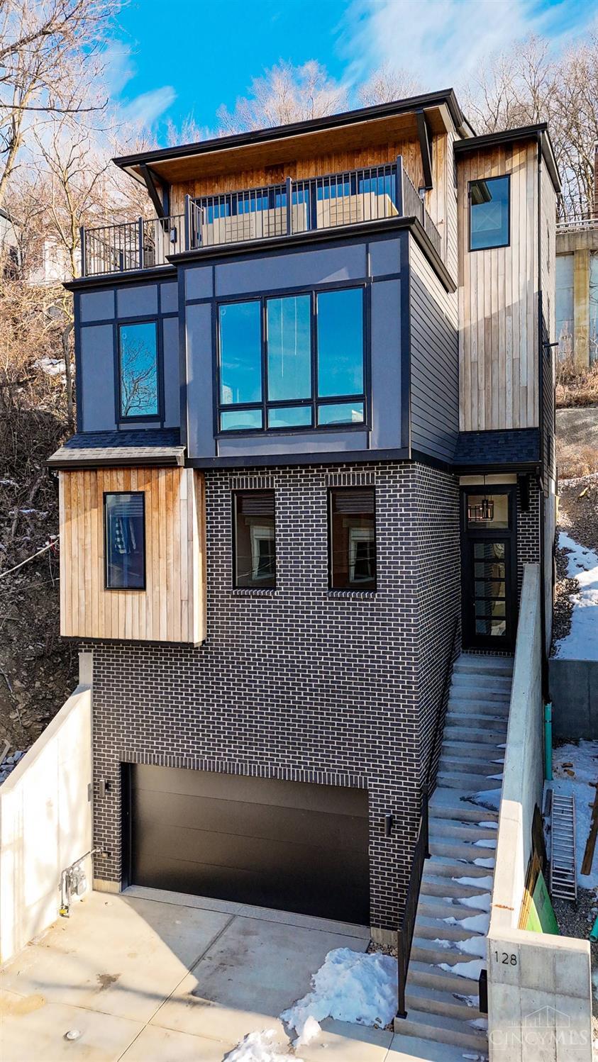 Spectacular Leed Platinum Home! Over $300,000 in Tax Abatement Incentives! Completed in 2024. High end appliances, gleaming HW floors. Spectacular top floor outdoor deck with fold away glass wall over looking the City. Oversized garage (room for a lift). Also, for lease for $4500 per month.
