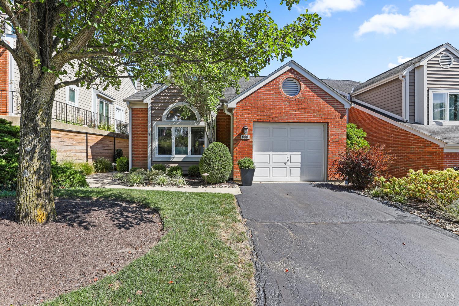 Open House Sunday 9/28 1:00 - 3:00 pm Premier townhome community in ultra-convenient location on a quiet street close to Mt. Lookout Square and Mt. Lookout Swim & Tennis Club. Well maintained and cared for by current owner, including several upgrades. Spacious living space with sunny skylights, a cozy fireplace, and doors that walk out to an inviting deck. A kitchen filled with charm and character including a large center island with added storage invites family and friends to gather and enjoy. 1st floor study. Inviting second-story primary suite with wonderful closet/storage space, luxury spa-like bath with every amenity. Lower level family room with large wet bar walks out to patio. Single car attached garage walks into the kitchen. Exterior of the unit and all lawn care is handled for you.