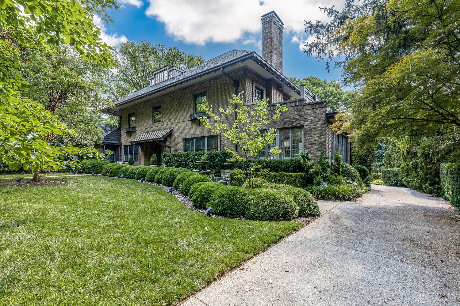 Extraordinary Italian Liberty influenced architecture in this totally renovated, turnkey home. Every room is exquisite. Custom, hand crafted, abundant Tiger Maple kitchen cabinetry and butler's pantry built by David T. Smith along with built-ins and bathroom cabinets throughout the home. Kitchen features wood-burning wall oven + 2 ovens. Bathrooms feature Italian marble vanities and tiles. Top of the line fixtures, designer lighting, stunning woodwork and flooring. Light filled throughout with views of incredible mature landscaping in private yard. Primary suite w/fireplace walks out to rooftop patio. 3 Bedrooms are spacious suites. The newly hardscaped backyard includes fire pits and a new spa set among mature Japanese Maples. With the large deck off the kitchen and pergola, it's a wonderful entertainment spot!  The basement was converted to a professional gym, which stays, with appropriate flooring and hidden storage behind secret doors in the paneling. Near best schools in Cincy!