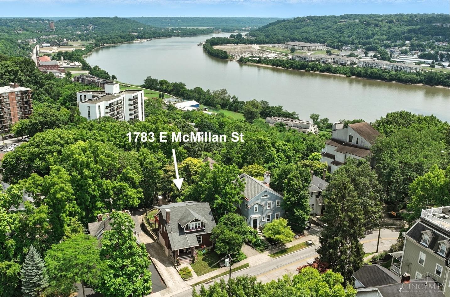 Prepare to be dazzled by this beautifully updated home in vibrant E. Walnut Hills with stunning 3-season river views! Offering 4 bedrooms, 3 full baths & nearly 2600SF, the home includes a rare lower-level apartment (2018) with walkout/private entrance, 1 BR/1BA, kitchen, dining & living areas - ideal for guests or income potential. Sun-filled interiors feature hardwood floors, original details & two solariums with wall-to-wall windows overlooking the serene wooded backyard. Outdoor living impresses with a new 10x30ft deck (2024), covered paver patio, fenced yard, fenced raised garden (2023) & detached patio. Ample parking with a long driveway & turnaround; detached garage converted to storage (2019) with exterior doors. Other updates: bedroom carpet/kitchen & solarium tile floor/wood fence (2024), rebuilt front porch/roof (2020) main roof (2017), water heater (2018), vinyl windows & HVAC (2010) & more! Just minutes to Downtown, Eden Park & Woodburn Ave shops & cafes.