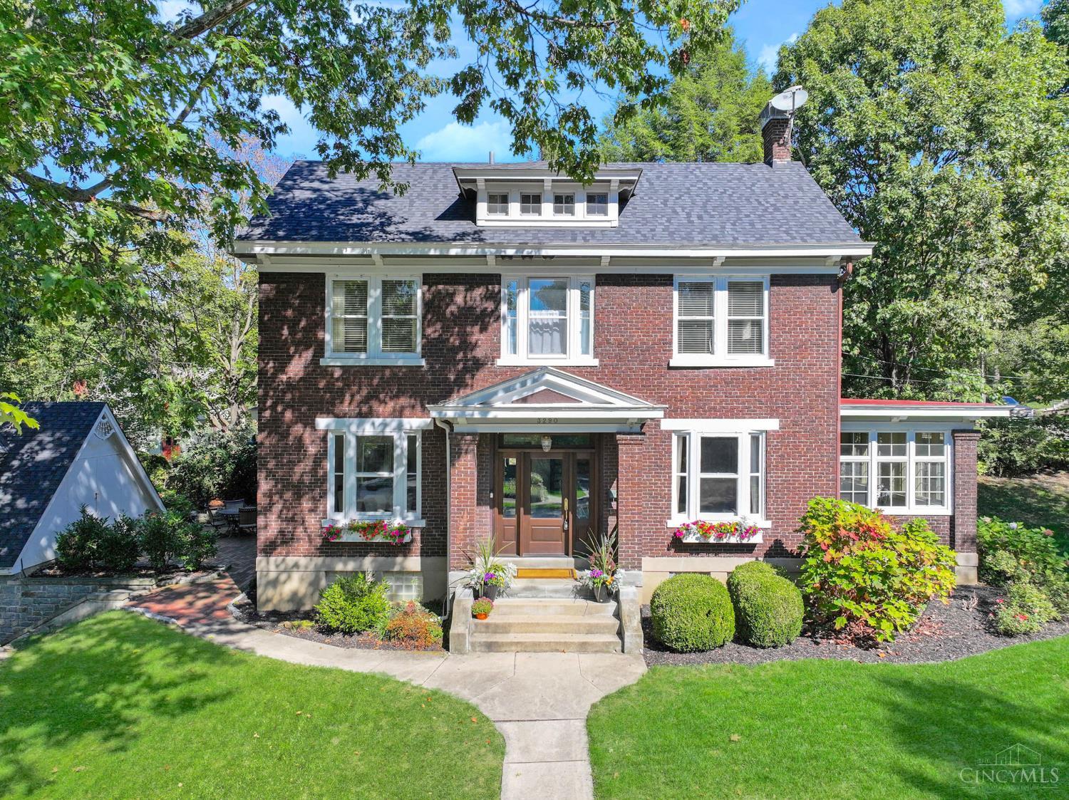 Timeless brick Colonial with many recent upgrades in the beautiful Observatory Historic district! The spacious, versatile layout is ideal for cozy comfort or entertaining guests. Elegant Foyer, crown molding, French doors, custom built-ins. First floor Living Room and Family Room. Remodeled Kitchen with 42 inch cabinets, granite, new appliances, 5 burner gas range, and Butler's Pantry with bev fridge! Professionally finished lower level in 2023 with Media Room, Rec Room, wet bar, and Bathroom! Primary Suite retreat with beamed ceiling, window seat, new Full Bath 2023! 2nd floor Laundry added. 2 Bedrooms with Jack & Jill Bath PLUS 2 more Bedrooms and new Full Bath on 3rd floor. Detached Garage with new door and loft area above. New Roof 2023, AC 2022, Furnace 2020. Amazing location near Ault Park! Walk or bike to Hyde Park Square, East Hyde Park, Wasson Way, and Hyde Park Plaza.