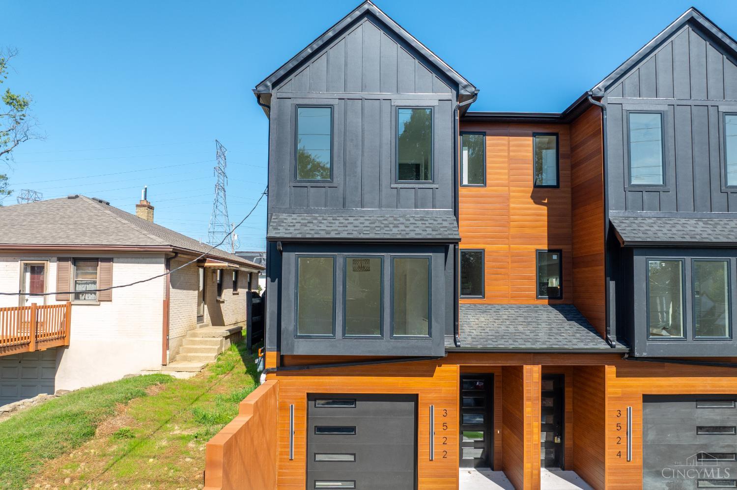 Brand New, move-In Ready, TAX ABATEMENT eligible town home in Oakley by the Funke Real Estate Group. Discover modern living at its finest in this thoughtfully designed home. The second level serves as the heart of the home, featuring an open concept gourmet kitchen, dining area, and great room. The great room is anchored by a sleek fireplace, flanked by built ins cabinets and bookcases, and opens directly to the back patio. A private study with custom built-ins provides the perfect work from home retreat. Upstairs, the primary suite boasts large windows, a chandelier, dual walk-in closets, and a spa-like bath (rainfall shower & smart toilet). Two additional bedrooms, each with walk-in closets, share this level, along with a conveniently located laundry room. Practical touches include direct garage access and a spacious, flat backyard complete with a privacy divider and storage shed. Best of all, you're just half a mile from all the shops, dining, and entertainment along Madison Road.