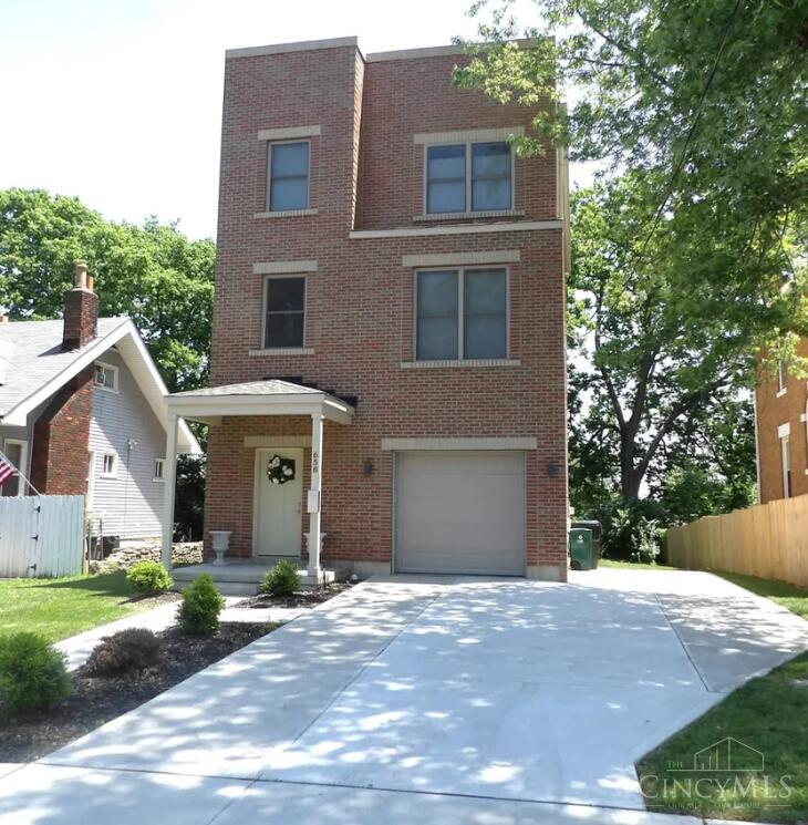 Welcome to the heart of Cincinnati's Incline District and be part of this thriving historic community. This elegant 3-story, 2,070 SF home features 3 bedrooms, 3 full baths, and a 2-car garage. High-end finishes include beamed ceilings, wood floors, granite and marble surfaces, and an open-concept layout. The first floor offers a walkout to a patio and yard, while the second floor opens to a private deck from a fully equipped kitchen with granite counters, island, and stainless steel appliances. Located just 5 minutes from downtown Cincinnati and major highways, you'll enjoy walkable access to restaurants, entertainment, and parks. A tax abatement is in place through 2033, with current annual taxes at just $302.28. This home is available for traditional sale, seller financing, or a 3-year lease/purchase program. The lease/purchase option requires a non-refundable partial down payment and first month's rent prior to move-in, with the down payment applied toward the purchase price.