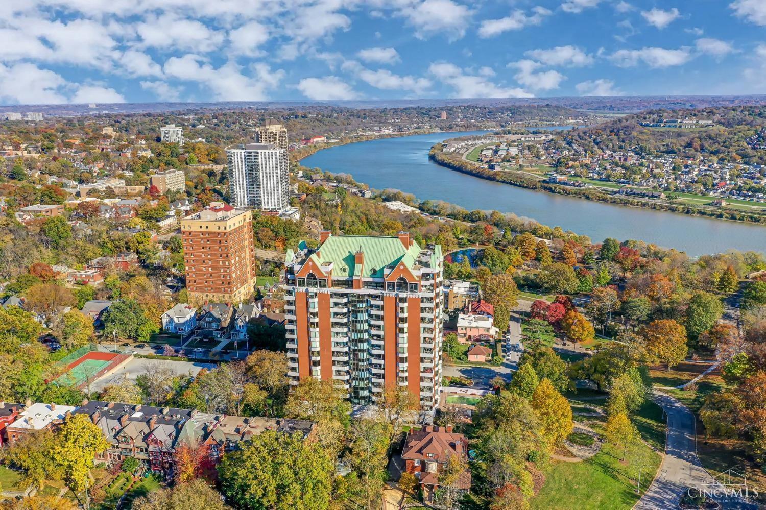 Luxury meets location- Stunning 1,824 SF 14th-floor condo at St. James, Eden Park. Floor-to-ceiling windows & balcony showcase the Ohio River, Downtown & KY hills. Private elevator, fireplace, Acacia hardwood, Cambrian wood cabinets, Kitchen Aid appliances, granite countertops. Primary suite w/walk-in & spa bath. Building amenities offer a new level of lifestyle that include porte-cochere, 24-hr doorman, concierge, pool with a sun deck, fitness center, tennis courts, event space, guest suites, 2 garage spaces, and 2 storage units. Steps to Eden Park, Art Museum, Krohn, Playhouse, and Mt. Adams breathtaking day & night views.