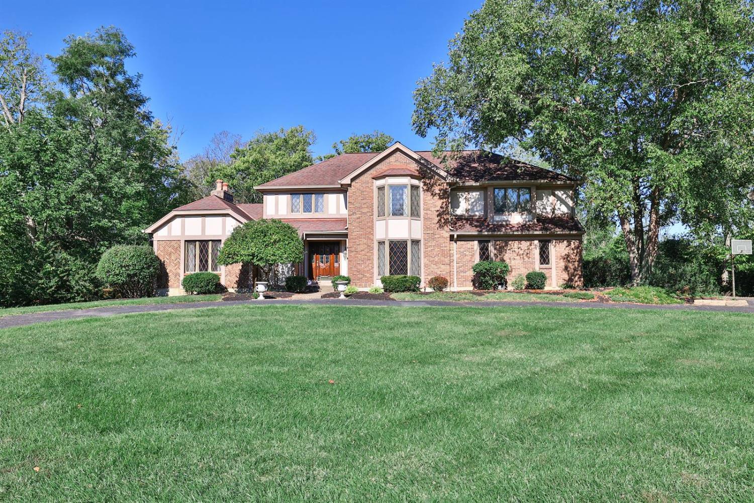 Opportunity knocks! Make this majestic Coldstream home your own! Abundant living spaces, elevator, huge kitchen/breakfast room, hardwood floors, and a spectacular oversized primary suite. Finished large double walkout LL with fireplace, bedroom and 2 full baths. Beautiful wooded acre of land. 4 car garage and a circle driveway. Convenient to downtown, schools, parks, shopping and airport. Do not miss this one!
