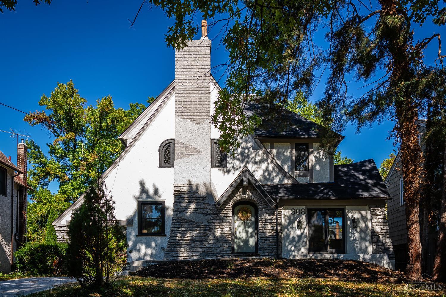 Charming Tudor in coveted Paddock Hills neighborhood! This spacious 4-bedroom, 2.5-bath home blends timeless character with thoughtful updates. Remodeled kitchen features granite countertops, New custom cabinets, slow close drawers & doors, ample workspace - perfect for everyday living and entertaining. 2 New full bathrooms. Enjoy generous living spaces including a formal dining room, family room, great room, and a private study.  Located just minutes from Xavier University, Oakley, Hyde Park, and the lateral expressway! Great location!