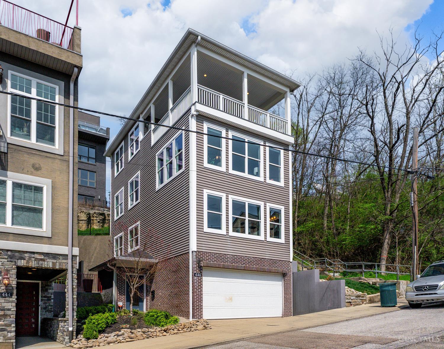 Tax abated through 2031, Save Over $8,000 Annually Through 2031! Take advantage of Cincinnati's Silver LEED tax abatement w/ a modern 4-story home featuring stunning city views and bright, open floor plan. Built 2016, this residence blends sleek design w/ thoughtful functionality. Inside, you'll find 3 bedrooms and 4 baths, including a flexible 3rd bedroom that easily serves as a home office, library/gallery, or guest suite. The kitchen and primary bath showcase elegant granite countertops, and the home is filled with natural light. A rare find for city living, this home offers a 2-car garage with premium Nature Stone flooring. Enjoy outdoor entertainment on the rooftop, covered terrace and take in the skyline views. Located less than a mile from I-71 and minutes from downtown, OTR, Washington Park, Findlay Market, the Banks, and Hard Rock Casino. This home offers the best of both worlds, downtown is just steps away, yet you'll enjoy the privacy and seclusion of Historic Prospect Hill.