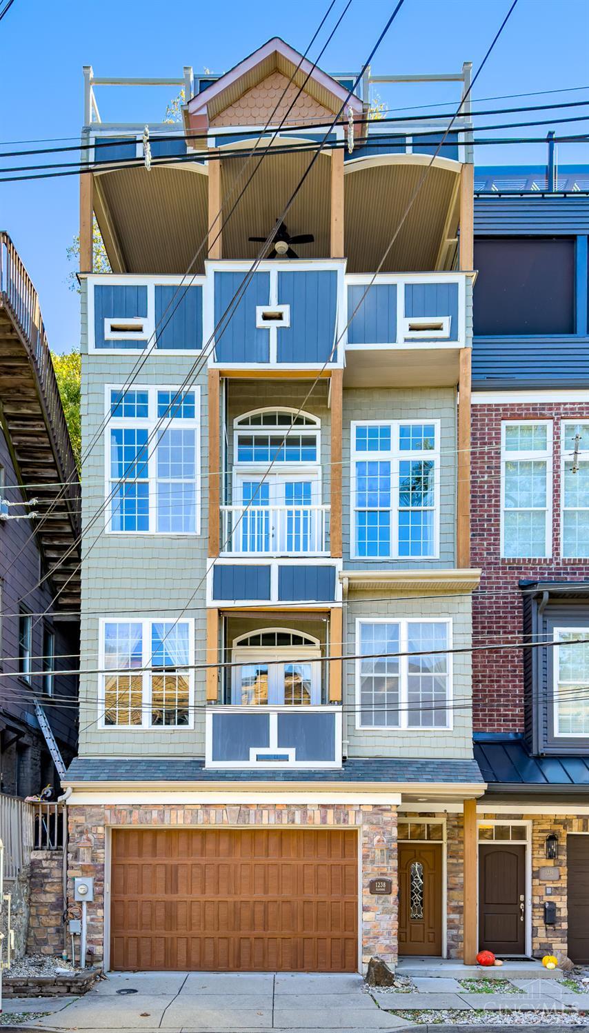 Stunning Modern Retreat in Historic Mount Adams!  Elevate your living at 1238 Elsinore Ave, Cincinnati, OH 45202. This 2008-built, 3BR/3.5BA gem offers 3,718 sq ft of luxury: hardwood floors, high ceilings, SS appliances, updated kitchen & baths, 3 fireplaces, elevator, walk-in closets, & in-unit laundry.  Panoramic views from balconies & rooftop deck with attached oversized 2-car garage. Pet-friendly with a private city feel. Walk to vibrant dining, shops, Eden Park, & downtown; 1 min to highways. Your modern haven awaits!