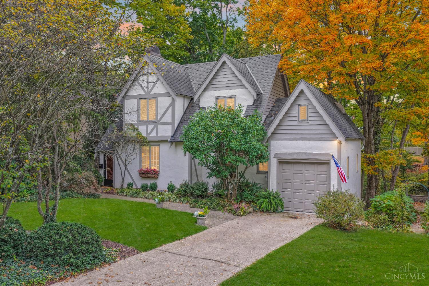 Impressive 1928 Tudor filled with unique architectural details AND located on one of Hyde Park's most sought after streets! Hardwood floors throughout the home. A spacious Living Room made for cozy nights around the gas fireplace. Updated, eat-in Kitchen with new commercial gas range plus a formal Dining Room. Fantastic wooded views from every window! Bright Sun Room with new windows and blinds. Finished lower level Family Room with walkout. Large Primary Suite with fireplace, walk-in closet and 2nd floor Laundry. Enjoy the private outdoor space on the deck and patio looking out to a fountain/pond and beautiful greenery. Walk over to Coffee Emporium, East Hyde Park businesses, and Ault Park! Located in Kilgour Elementary district. This gas light and tree-lined street is the perfect spot to call home!
