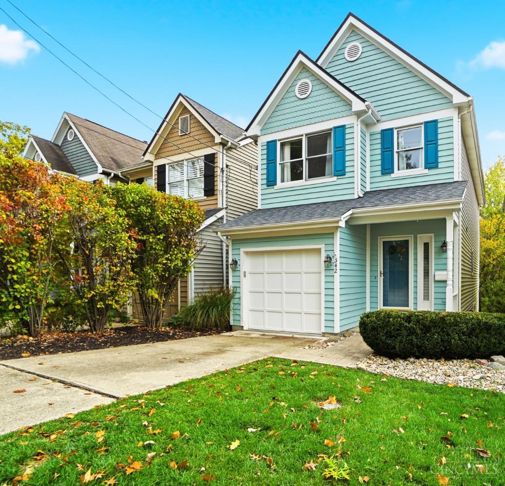 From the front door to the hardwood deck, this serene home greets you with beautiful views of the wooded area behind. Natural light flows through the open-living main floor, reflecting off gleaming hardwood floors. Quartz counters and stainless appliances including an induction range complement the light and bright kitchen, and a roomy dining area connects main level living spaces. Enjoy the convenience of a first-floor half bath and direct access from the attached garage. With two primary bedrooms upstairs and a flex space with full bath in the lower level, this versatile floorplan hits all the right notes. A calming space with freshly painted rooms and new carpeting, take advantage of over $40k in upgrades this year. Get ready for a cozy winter with the 98% efficiency furnace and gas fireplace. Offering both style and substance, this home features a new roof, furnace, and AC in 2025! Great location near area amenities. Review attached feature sheet for many more upgrades.