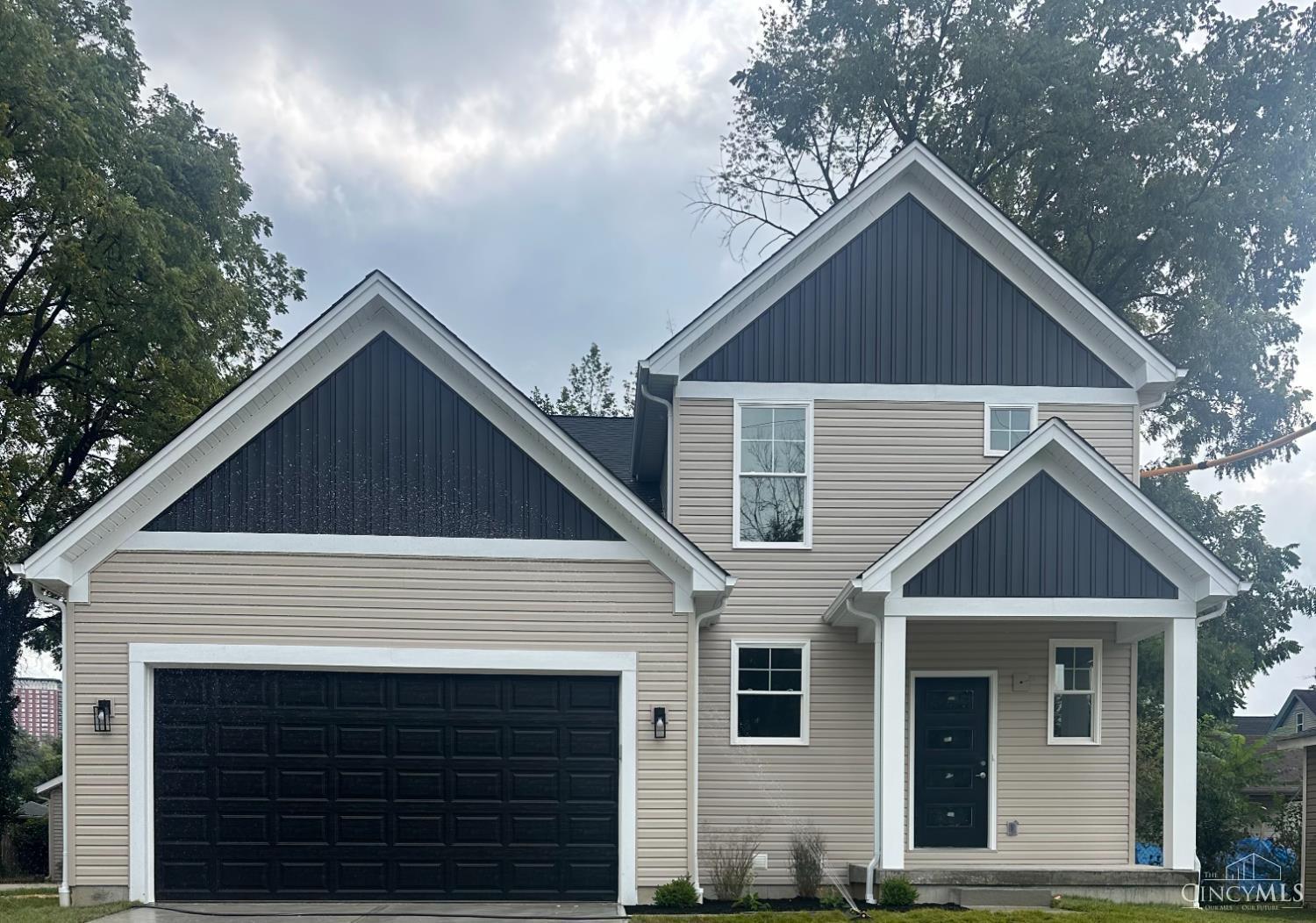 Modern Elegance Meets Everyday Comfort! This stunning & rare new build offers 5 spacious bedrooms and 3.5 baths, including a luxurious first-floor owner's suite. The open-concept main level showcases a designer kitchen that seamlessly flows into the family and gathering rooms ideal for entertaining in style. The finished lower level features a media room, bedroom, and full bath for added versatility. Step outside to the beautiful patio for relaxing or dining outdoors. With laundry on both levels, high-efficiency systems, silver LEED certification, and eligibility for a 10-year tax abatement, this home combines sophistication with smart living. Agent Owned.