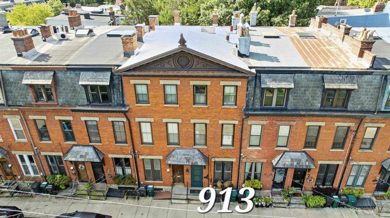 Ideal floor plan flow and large dining room for upcoming holiday celebrations and comfortable living in this gorgeous Brownstone. Custom cabinetry, Subzero, Bosch, granite kitchen. Generous room sizes throughout. Hardwoods. Wool carpet upstairs. Exposed brick. Soaring ceilings. Skylight. In ceiling stereo and outside rear stereo. LL family room. Multiple storage areas. Playhouse in Park directly in front of house. Relaxing, private, TimberTeck deck in rear. Carefree living with no hoa fees. Easy walk to Art Museum, Mt Adams pool, Luca Bistro, Al'Lupo, the Bar & Grill, Blind Lemon, UDF, El Barrill, salons/spas & all the shops/bars/restaurants in the business district. Some recent updates: washer & dryer, HVAC, dishwasher, sump pump, water heater. Home warranty in place.