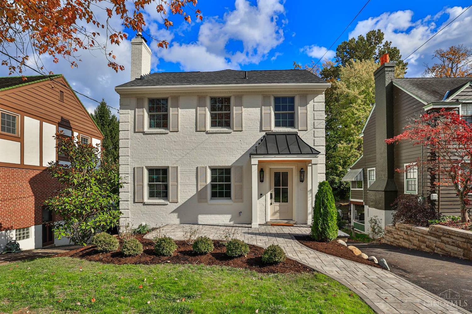 Old-world charm meets modern living! Completely renovated for today's tastes, this home features light-filled rooms, modern lighting, gleaming hardwood floors, & custom built-ins throughout. The inviting living room centers on a fireplace flanked by shelves. The expansive family room offers another fireplace, custom shelving, & a walkout to a large deck & is deal for relaxing or entertaining. The open kitchen is a chef's dream with top-quality appliances, spacious center island with seating, & abundant custom cabinetry. A convenient bar near the dining room makes hosting easy. A magnificent primary suite includes space for a seating area, tray ceiling, & walk-in closet. The lower level offers a large rec room & full bath & is perfect for play or guests. Enjoy a welcoming front porch, flat yard, & an unbeatable location close to both Squares. Offers open for 48hrs. No escalation clauses. Seller will be applying for abatement, house is 3270 Sq Ft and eligible for a $250k 8 yr abatement.