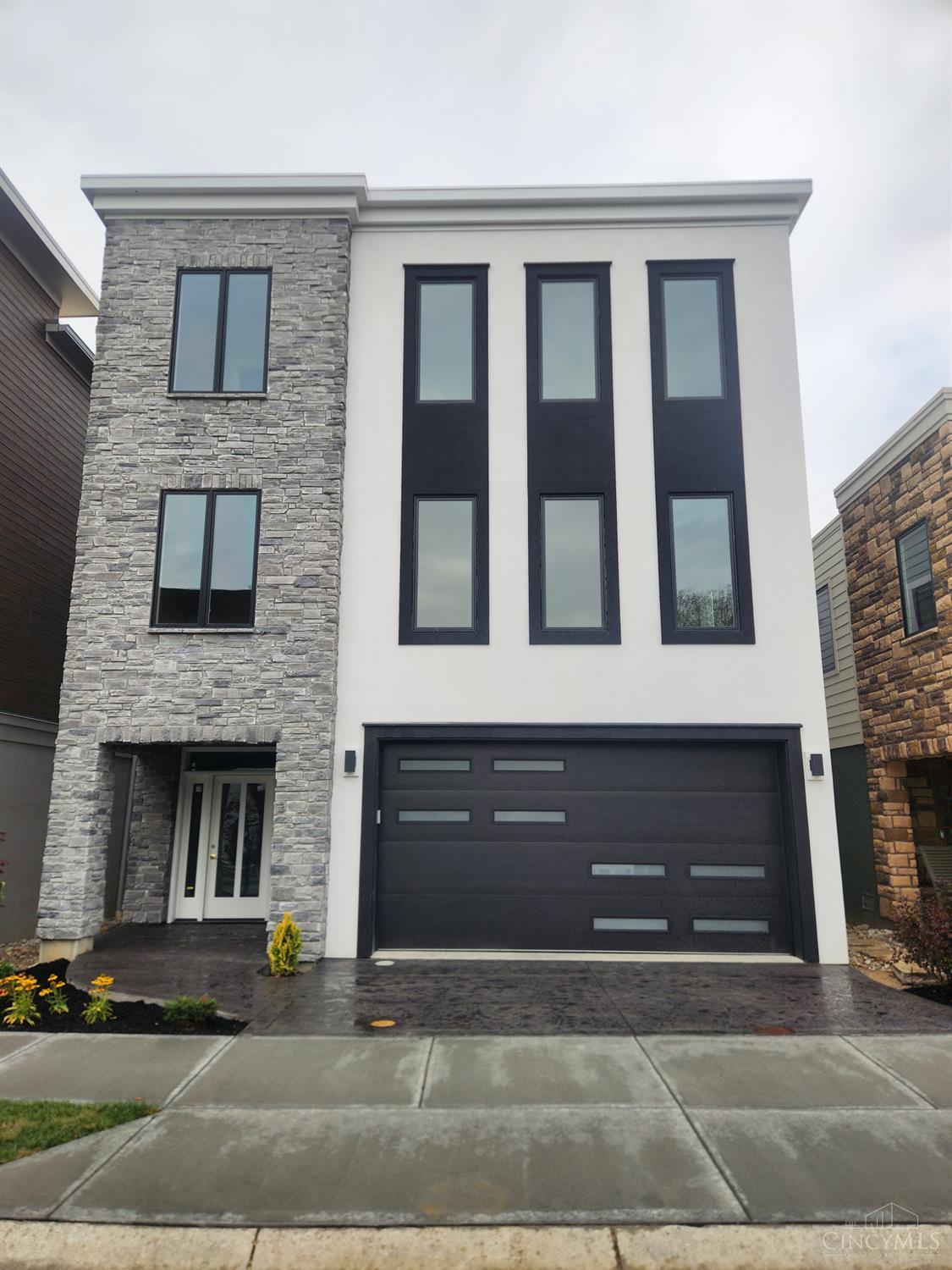 REMARKABLE RIVER FRONT HOME! 2 Stunning Primary Suites w/Beautifully Customized Porcelain walk in showers! 3 secondary bedrooms,comfortable study/lounging rm walk out to a covered deck with a fabulous Water View! Joe Zang's infamous attention to detail brings this finish level to unmatched heights! Selections made are Rich and Tasteful offering a clean yet warm elegance to this home. The Views are nothing short of spectacular w/o any effort from all three levels! Easy Access to all three levels by elevator or stairs! This Home is Truly a Gem in a Riverview Community w/ commercial boat ramp,seasonal dock, walking trail and community fire pit along the River bank, neighborhood Park w/play yard and ball fields, Easy access to Cincinnati's renown bike trails. Completion by 12/31/25. There is still time to make personal selections regarding the second/prep kitchen/content and finishes and closet personalizations . This home is a  Showstopper!Unlimited Platinum 15 yr abatement.