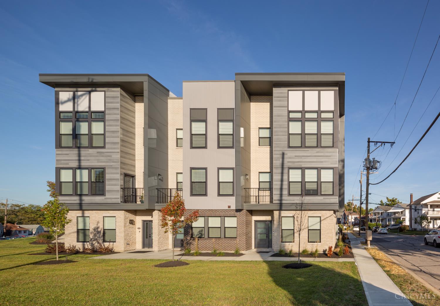 Welcome to the Model. Modern 2022 built three story 3 and 4 bedroom townhomes, just steps away from Oakley Station, Madtree and Oakley Square. Featuring 9 ft ceilings, wood style floors, large windows, and a stylish kitchen with quartz countertops, and soft close wood cabinetry. Dual balconies for seamless indoor-outdoor living. The upper level offers a primary suite with a large walk-in closet, luxury bath, plus additional bedroom(s), full bath, and convenient laundry. The lower level includes a guest suite or office with a full bath. Enjoy low-maintenance living with a 2-car EV ready garage-tax abated through 2032.