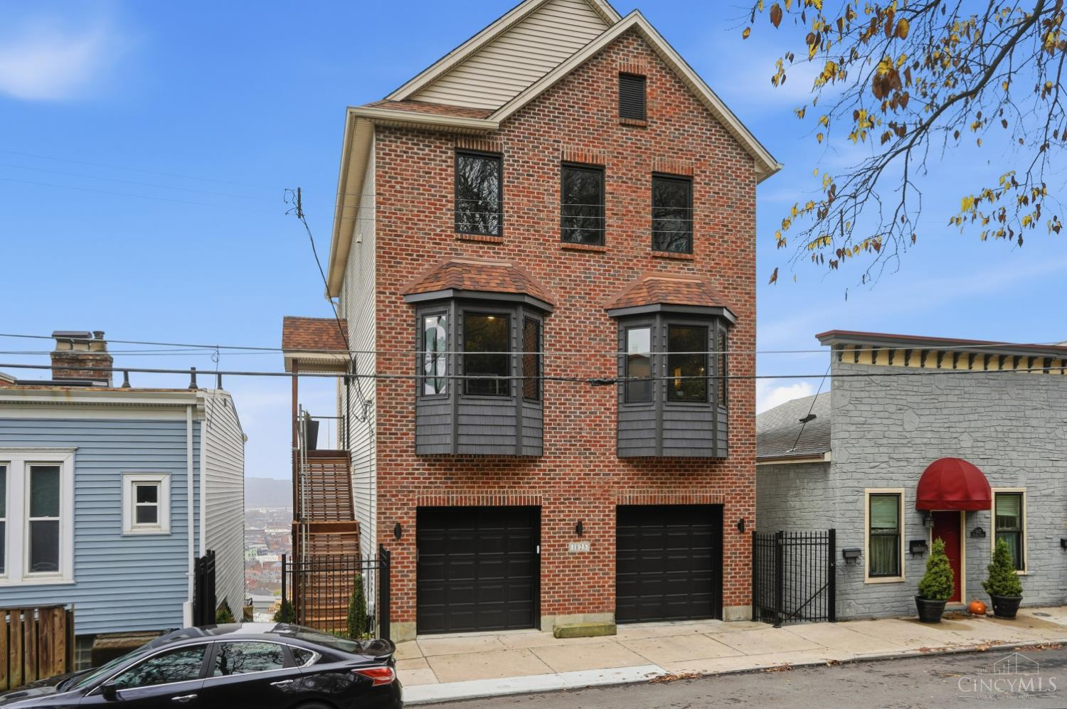 Perched high in Mt. Auburn and overlooking the Cincinnati skyline, this 3 story stunner delivers the kind of views people dream about.  Every level opens to it's own private deck and the panorama gets more jaw dropping with each flight of steps you take. Inside the home is  beautifully appointed from top to bottom, spacious and stylish. This home brings Cincinnati's best right to your doorstep. Move in, look  out and fall in love with the view!