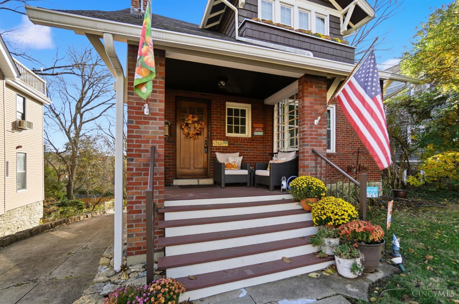 Motivated Seller open to ALL reasonable offers! Enjoy 3-season city/river views & a lower level apartment w/ private entrance & covered paver patio ideal for guests or rental income. Charm, location & updates seamless blend in this unique & beautifully renewed 4BR/3 full BA home in hot E. Walnut Hills! Bigger than it looks - nearly 2,600 SF of living space home. Bright interiors showcase original hardwood floors & details & 2 window-lined sunrooms overlooking the peaceful & lush backyard. Outdoor living shines with a 10x30 deck ('24), fenced yard, raised garden ('23) & detached patio facing the city & river. The long driveway w/ turnaround provides easy off-street parking-the garage was converted to storage ('19). Prime location near downtown, Eden Park, Hyde Park, Woodburn Ave cafes. Recent updates: bedroom carpet, tile floors in the 1st flr sunroom, privacy fence ('24), front porch 2020, main roof 2017, porch roof 2020, WH 2018, HVAC & windows 2010.