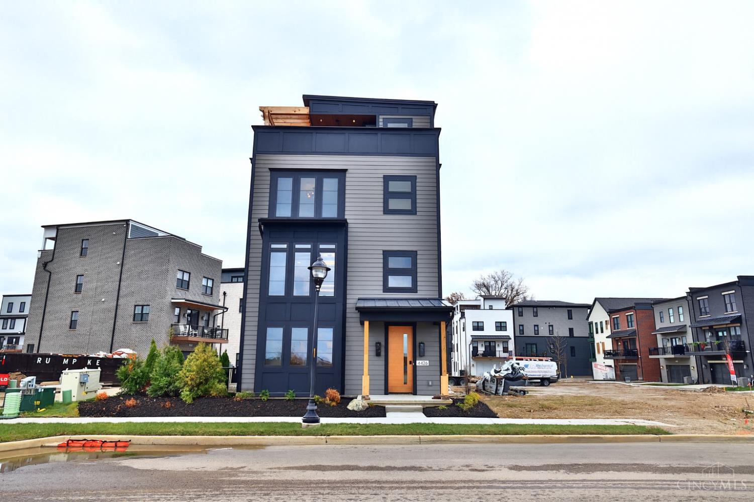 Custom designed by WP Land at Foundry Park, home of Homearama 2025, this home features an inviting front porch, first-floor office, kitchen open to dining and living rooms, and elevator for convenience. High-end finishes include site-finished hardwood floors, quartz countertops, solid core doors, and crown moldingall signature WP Land details. Lot 12.