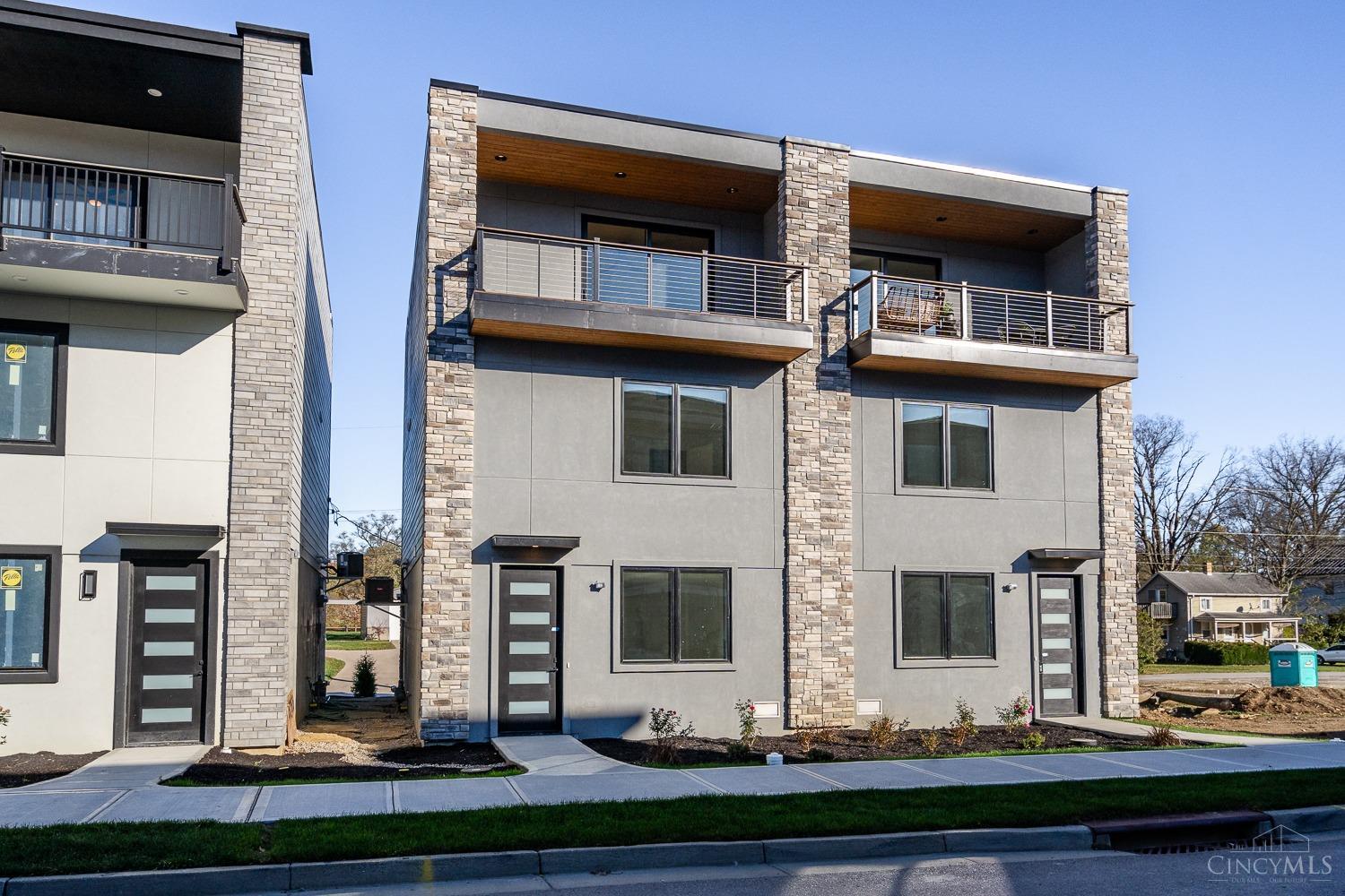 Sophisticated living at The Sanctuary at River Green with panoramic river and rolling hill views! This new construction Gold LEED Certified home provides fantastic energy savings and is tax abated for 15 years.  Modern high-end design finishes with hardwood floors throughout and a fabulous open floor plan that walks out to the covered front balcony- perfect for outdoor entertaining with a view! Enjoy quartz counters, stainless appliances and custom wood cabinetry. Enjoy easy living and entertaining with boat ramp access, community fire pit and gathering area on the river's edge, dog park, and community garden all while being minutes to Riverbend, Belterra, and easy highway access. Attached garage with space for up to 3 cars and plenty of room for storage.