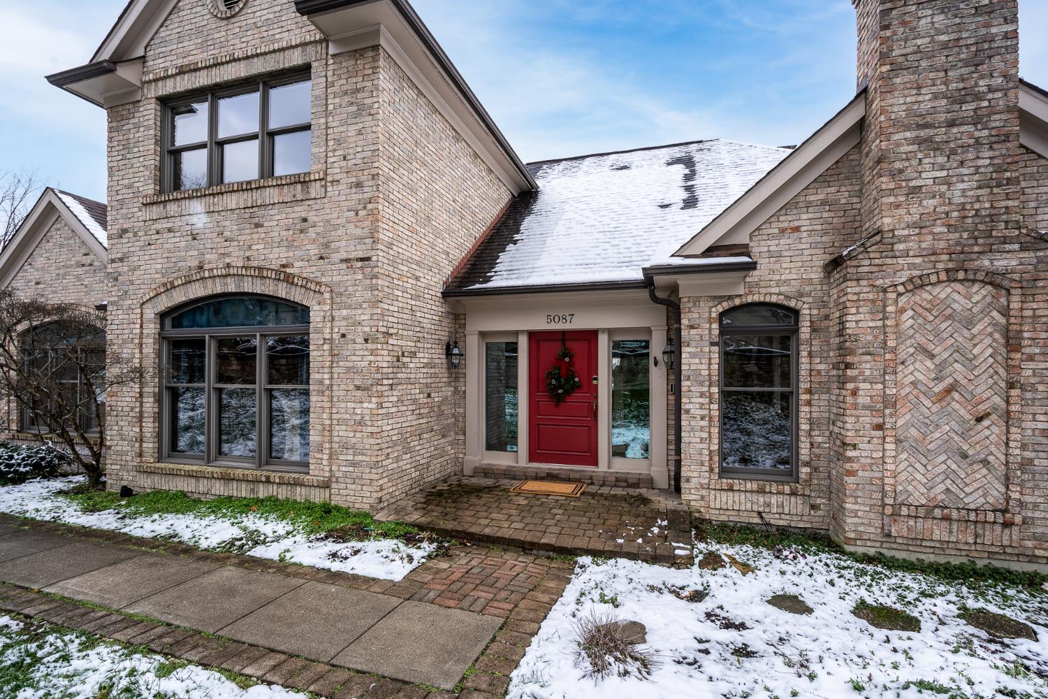 Enjoy a unique blend of space, comfort, and convenience in this beautifully maintained home with scenic valley views and a flexible floorplan designed for everyday living and entertaining. The main level features a welcoming entry, hardwood floors, multiple gathering spaces, and a standout first-floor owner's suite offering privacy and ease of living. The kitchen opens to a bright breakfast area and three-season room, while the vaulted family room with stone gas fireplace creates a warm focal point.    The finished walk-out lower level expands the living space with a large recreation room, wet bar, full bath, and bonus room ideal for guests, hobbies, or a home office. Outdoor living is effortless with multi-level decking and a covered patioperfect for relaxing while taking in the views. A smaller yard offers low-maintenance appeal, and the location provides quick access to downtown, Hyde Park, Oakley, and Columbia Parkway.