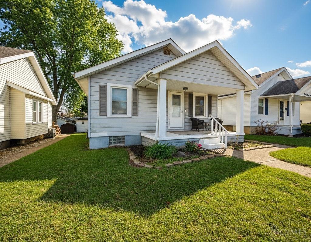 Don't miss this affordable 2/3 bedroom, 1-bath home with 1100 sq. feet of inviting living space.  The knotty pine family room creates a cozy gathering area, or could be used as a 3rd bedroom, while the attached garage offers convenient lower level access.  Spacious living room and updates include newer roof and windows.  Enjoy a fenced backyard - perfect for pets, gardening or summer evenings.  A smart start to homeownership!