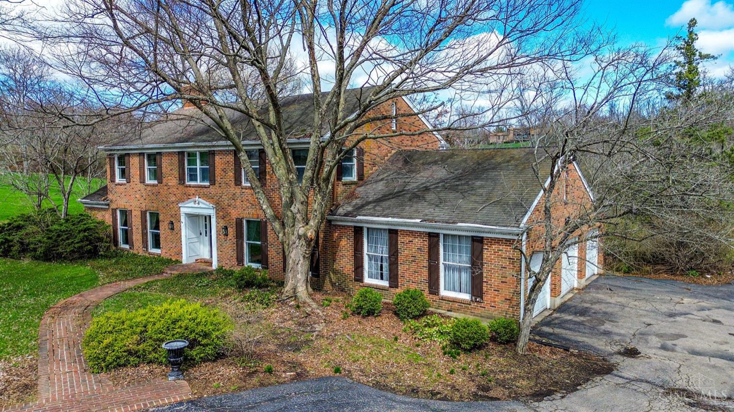 This stately brick colonial sits on a beautiful 1.5‑acre lot in an exquisite, established neighborhood. With 2,982 square feet, the home offers four spacious bedrooms, two and a half baths, and a side‑entry three‑car garage. Inside, hardwood floors add warmth throughout, complemented by rich cherry cabinets in the kitchen. Two fireplaces bring classic charm, while a bright solarium at the back provides a peaceful year‑round retreat. The home is in need of some repairs, offering an excellent opportunity to update and personalize. With its generous lot, timeless architecture, and prime location, this property holds exceptional potential.