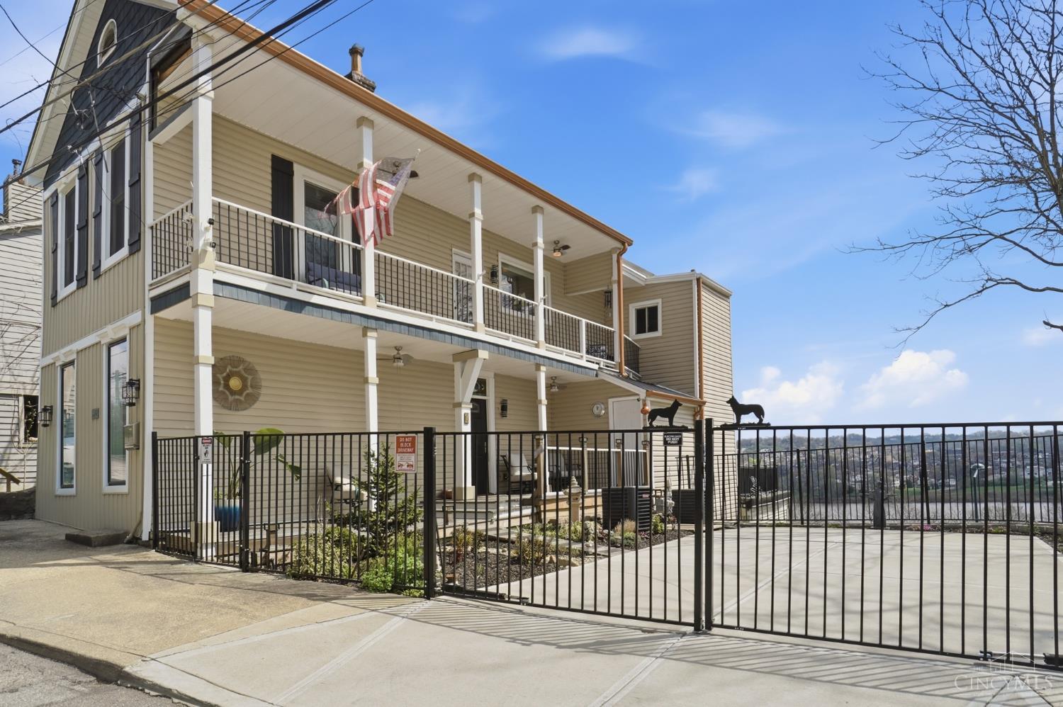 Rare Mt. Adams find perched above the Ohio River! Imagine waking up to jaw-dropping river and skyline views from your own private decks, plus a coveted private 2-car driveway  a true rarity in this neighborhood. Sip morning coffee, dine al fresco, or watch the sunset from your own outdoor retreat. Inside, an open floor plan centers on a beautifully updated custom kitchen with generous prep space, quality finishes, and abundant natural light throughout. Flexible living areas adapt easily to entertaining, working from home, or hosting overnight guests, while the layout offers both open gathering space and quieter corners for everyday living. Minutes from downtown Cincinnati, major hospitals, restaurants, parks, and nightlife, this home blends privacy, convenience, and unbeatable views. Properties with this rare combination of location, parking, outdoor living, and skyline views don't come around often  a true Mt. Adams gem.